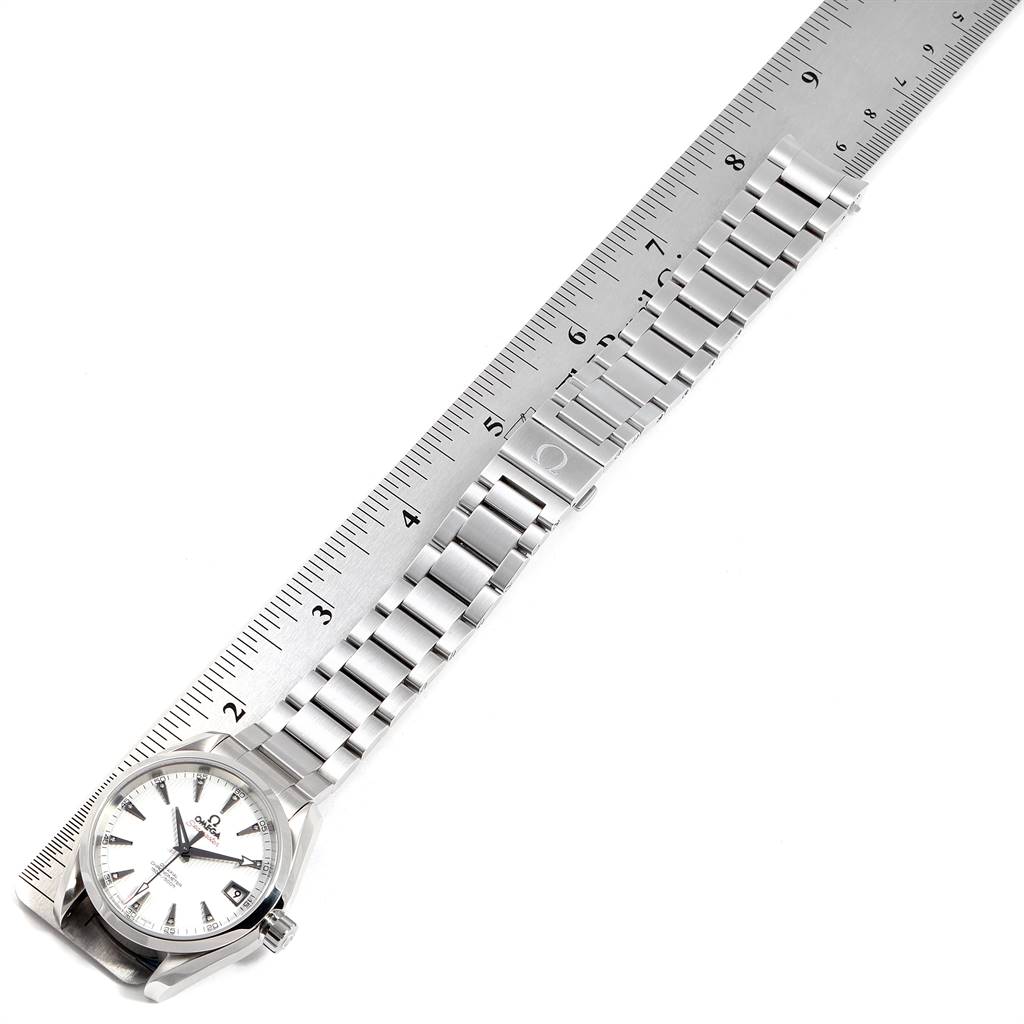 The image shows an Omega Aqua Terra 231.10.39.21.54.001 Men
s Stainless Steel White Dial 231.10.39.21.54.001 Men
s Stainless Steel White Dial model watch laid flat next to a ruler, displaying the full length of the watch including its face and bracelet.