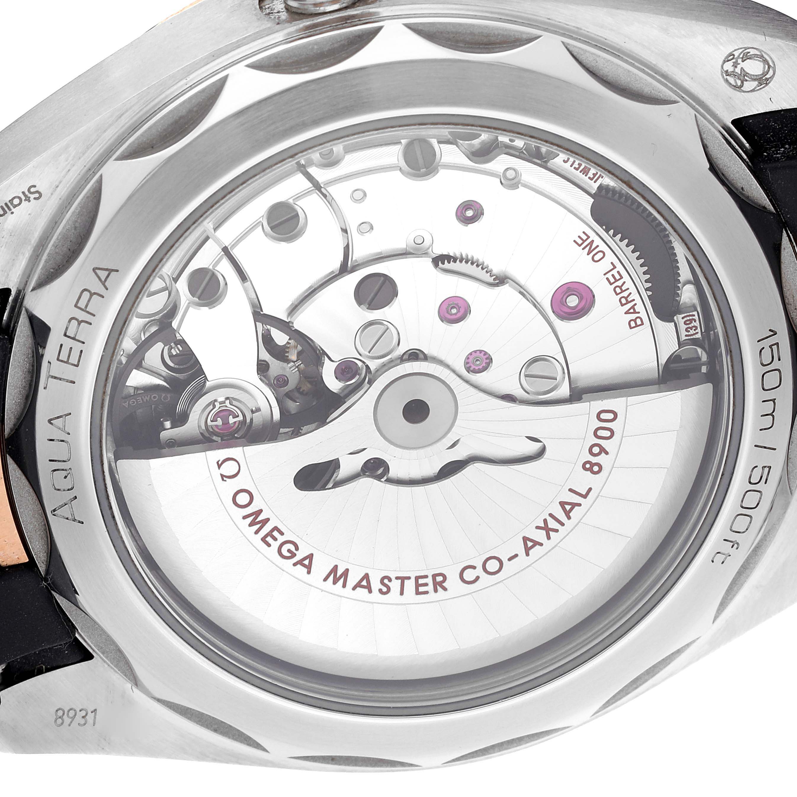 The image shows the back view of an Omega Aqua Terra 220.22.41.21.02.001 Men
s Steel and Gold (two tone) Silver Dial 220.22.41.21.02.001 Men
s Steel and Gold (two tone) Silver Dial watch displaying its movement and inner workings.