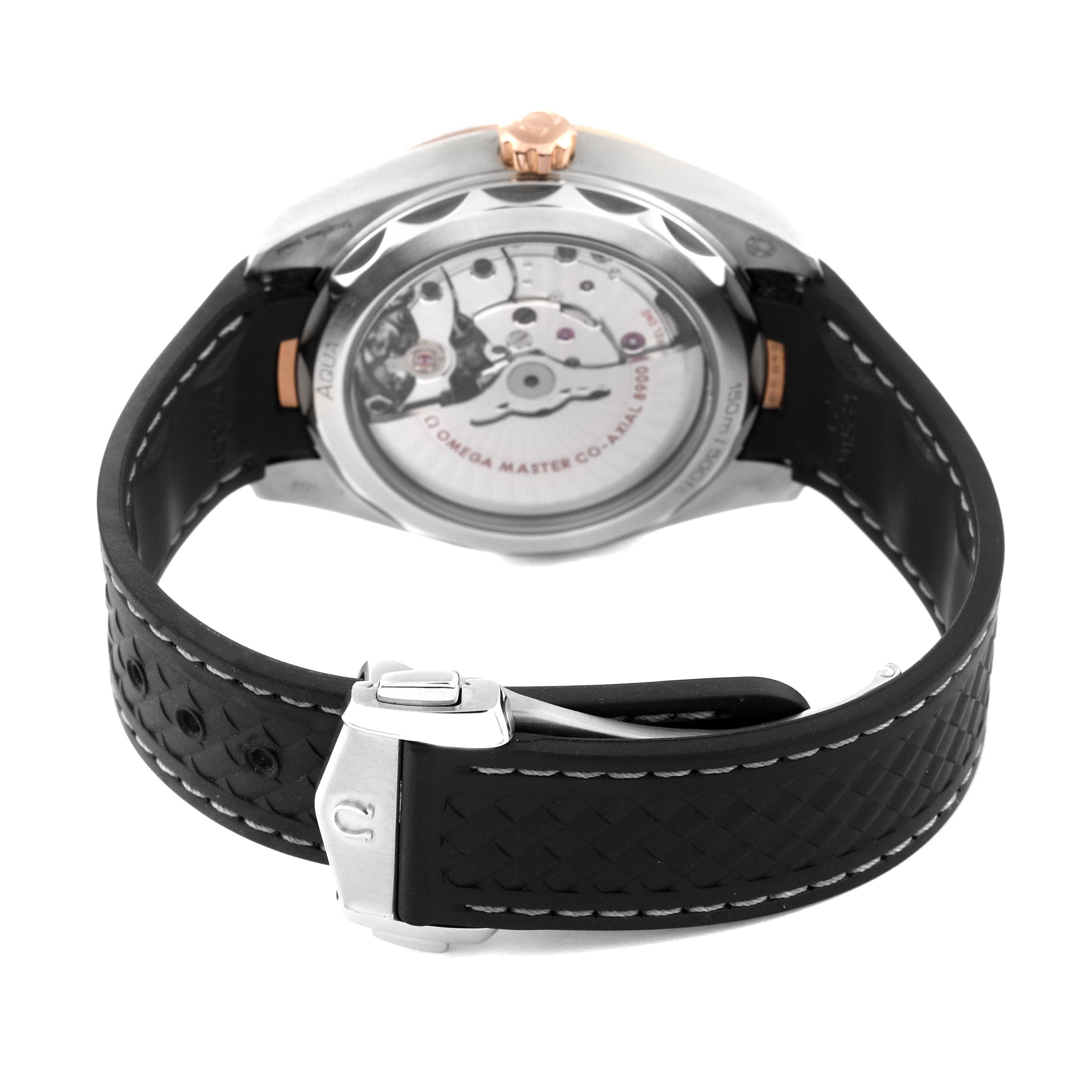 This image shows the back view of the Omega Aqua Terra 220.22.41.21.02.001 Men
s Steel and Gold (two tone) Silver Dial 220.22.41.21.02.001 Men
s Steel and Gold (two tone) Silver Dial watch, highlighting its transparent case back and black strap with a clasp.