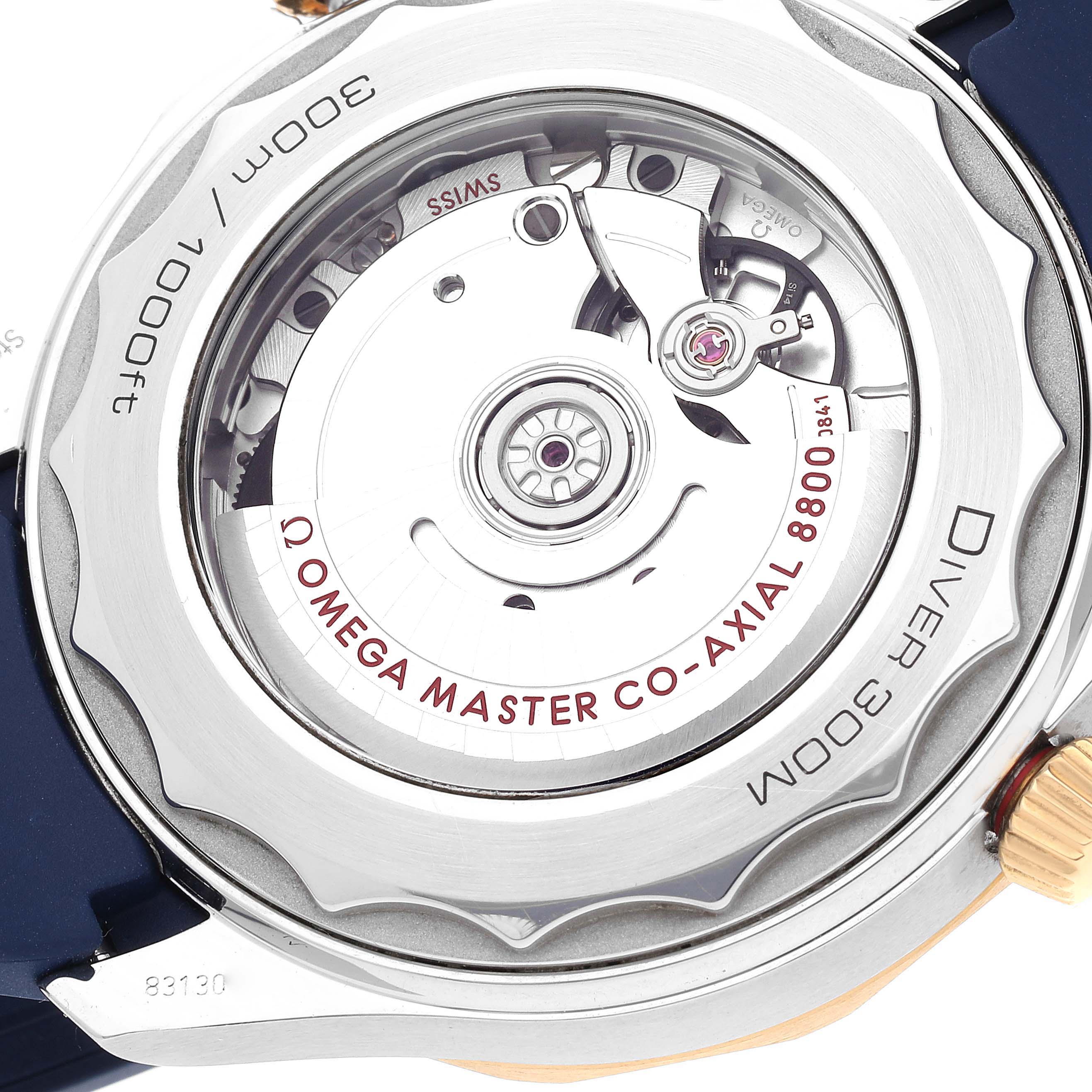 The image shows the back case of an Omega Seamaster 210.22.42.20.03.001 Men's Steel and Gold (two tone) Blue Dial 210.22.42.20.03.001 Men's Steel and Gold (two tone) Blue Dial, highlighting its Omega Master Co-Axial 8800 movement.