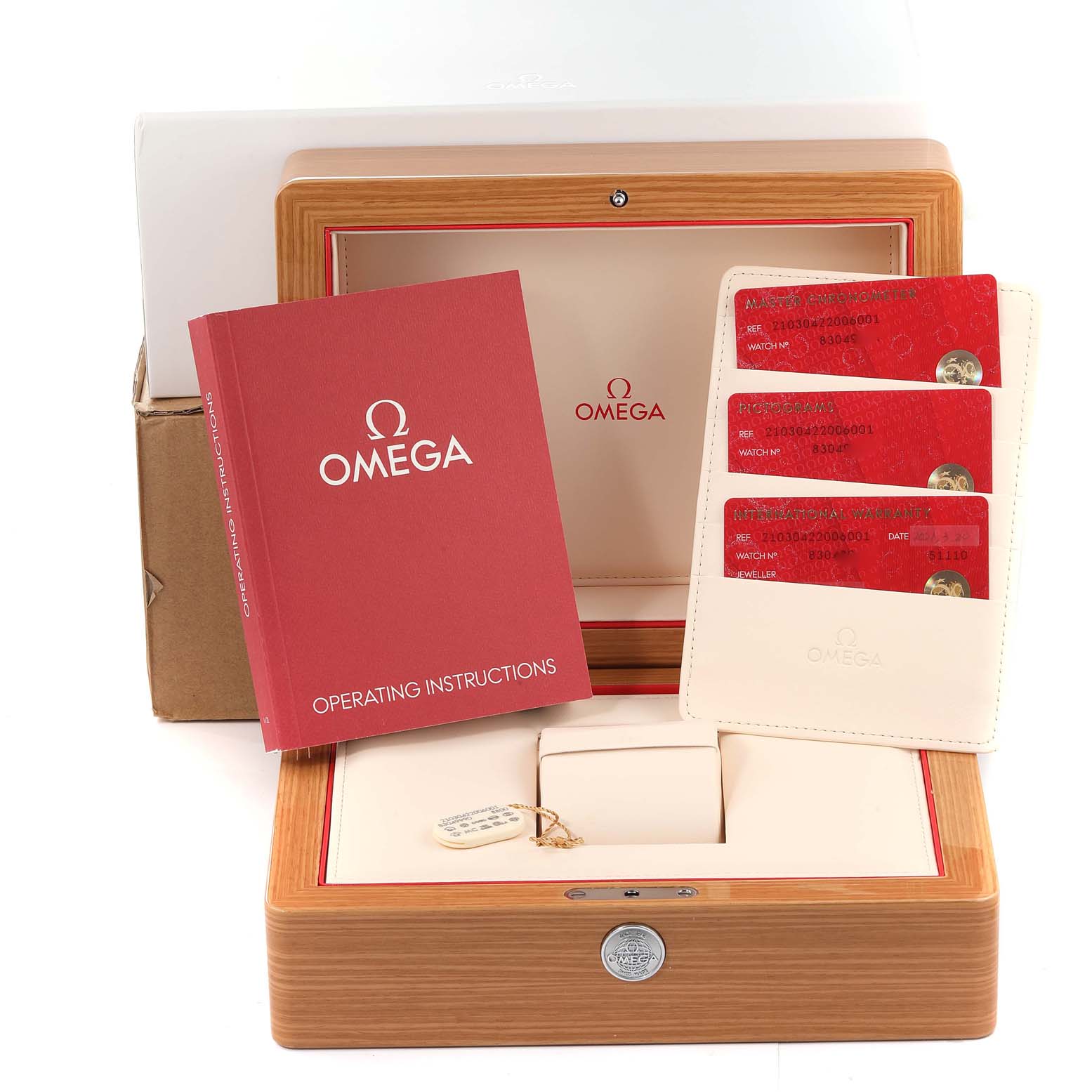 The image shows a Seamaster model by Omega, including the watch box, instruction manual, and certification cards.