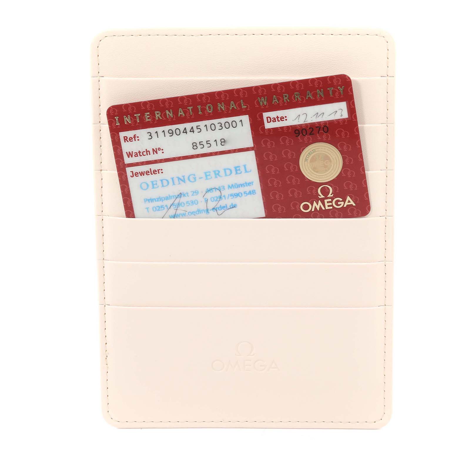 The image shows an Omega Speedmaster 311.90.44.51.03.001 Men's Stainless Steel Blue Dial 311.90.44.51.03.001 Men's Stainless Steel Blue Dial International Warranty card in a white cardholder.