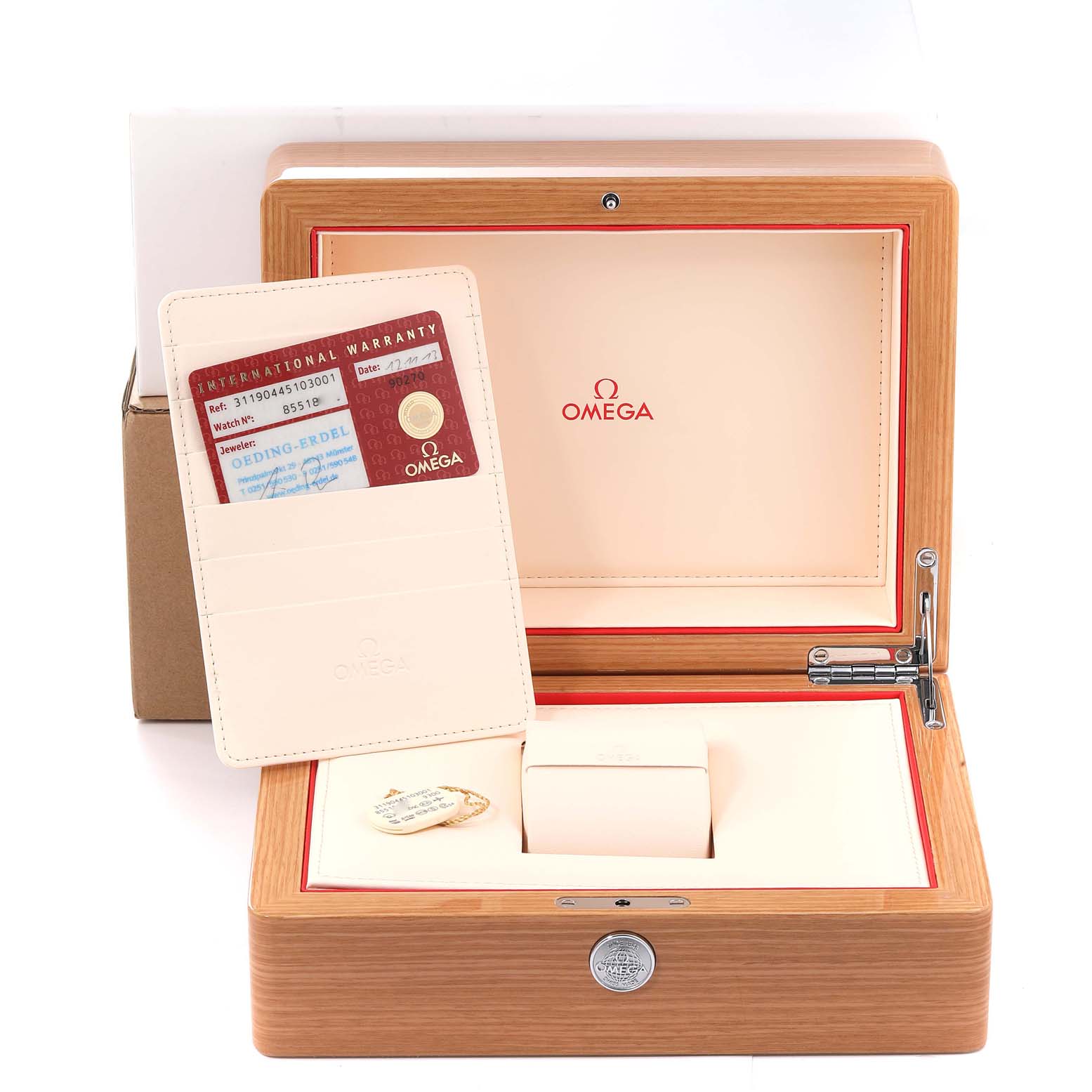 The image shows an Omega Speedmaster 311.90.44.51.03.001 Men's Stainless Steel Blue Dial 311.90.44.51.03.001 Men's Stainless Steel Blue Dial watch box, warranty card, and protective casing from a front angle.