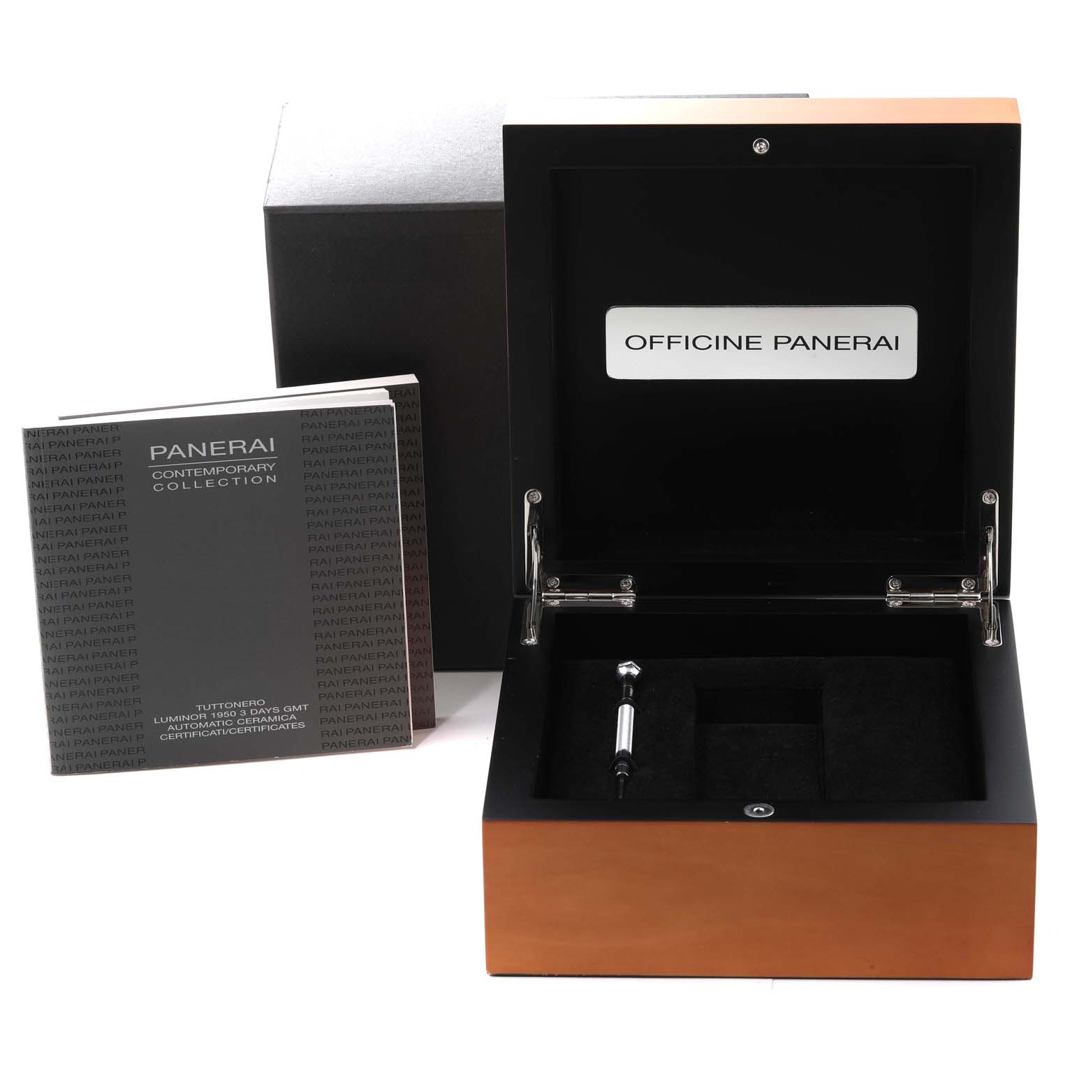 The image shows an open Panerai Luminor PAM00438 Men's Ceramic Black Dial PAM00438 Men's Ceramic Black Dial watch box, a booklet, and a tool for the watch.