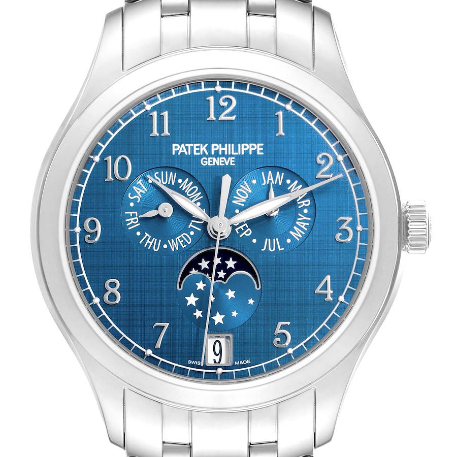 The Patek Philippe Complications model 4947/1A-001 is shown from a frontal angle, displaying its blue dial with a calendar and moon phase features.