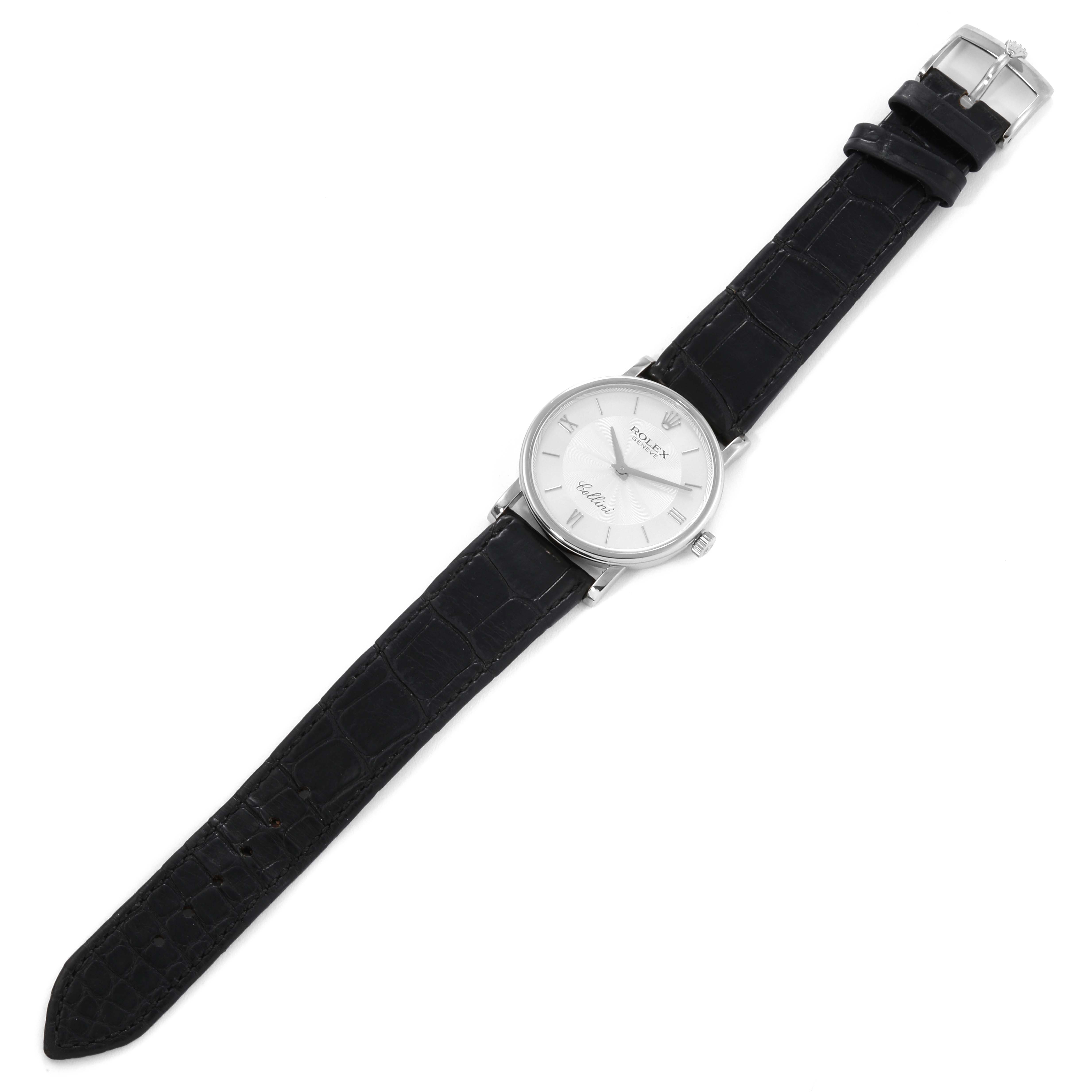 The image shows a top view of a Rolex Cellini 5115 Men's White Gold Silver Dial 5115 Men's White Gold Silver Dial watch with its black leather strap fully extended and visible.