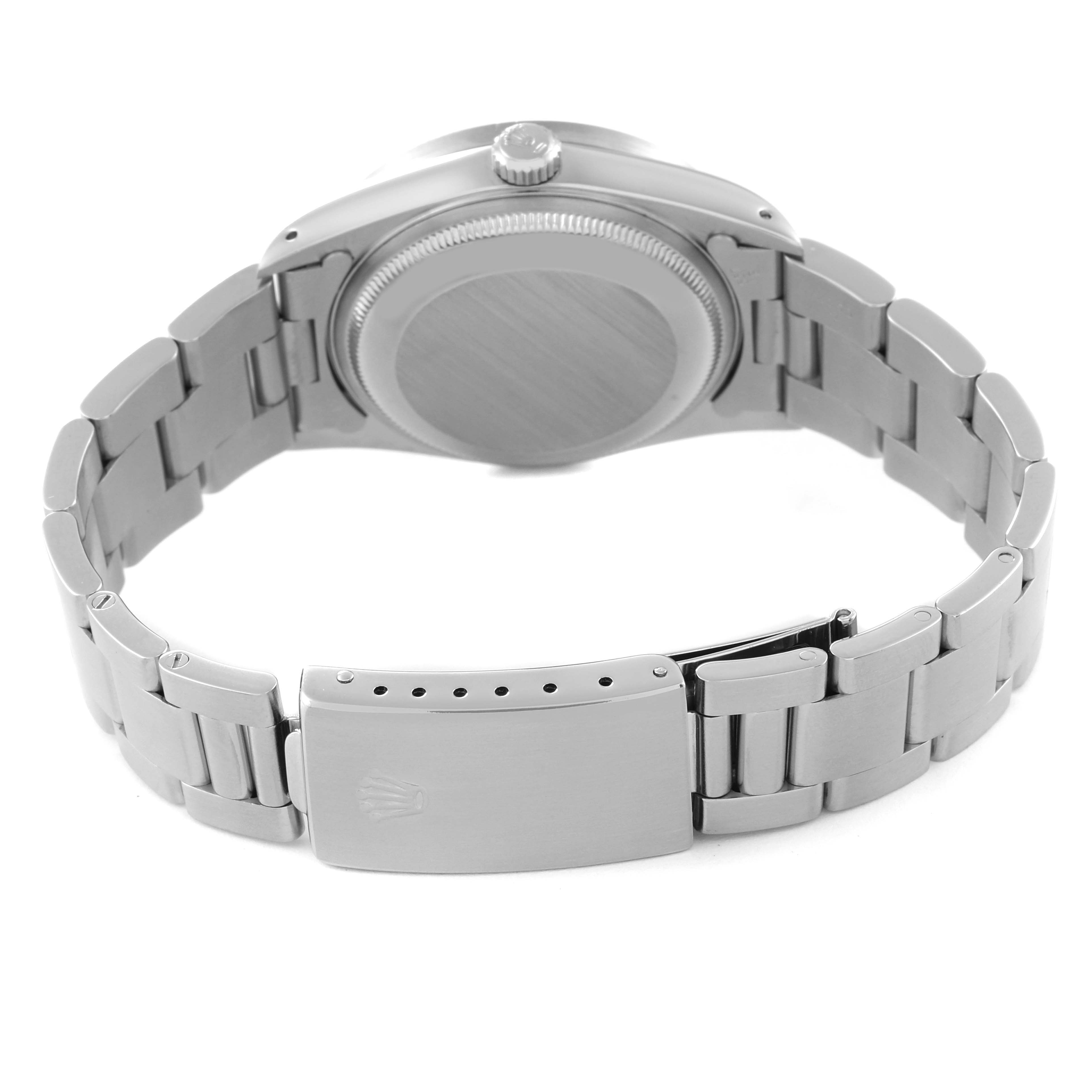 The image shows the back of the Rolex Date 15210 Men's Stainless Steel Black Dial 15210 Men's Stainless Steel Black Dial model watch, highlighting its clasp, bracelet, and case back.