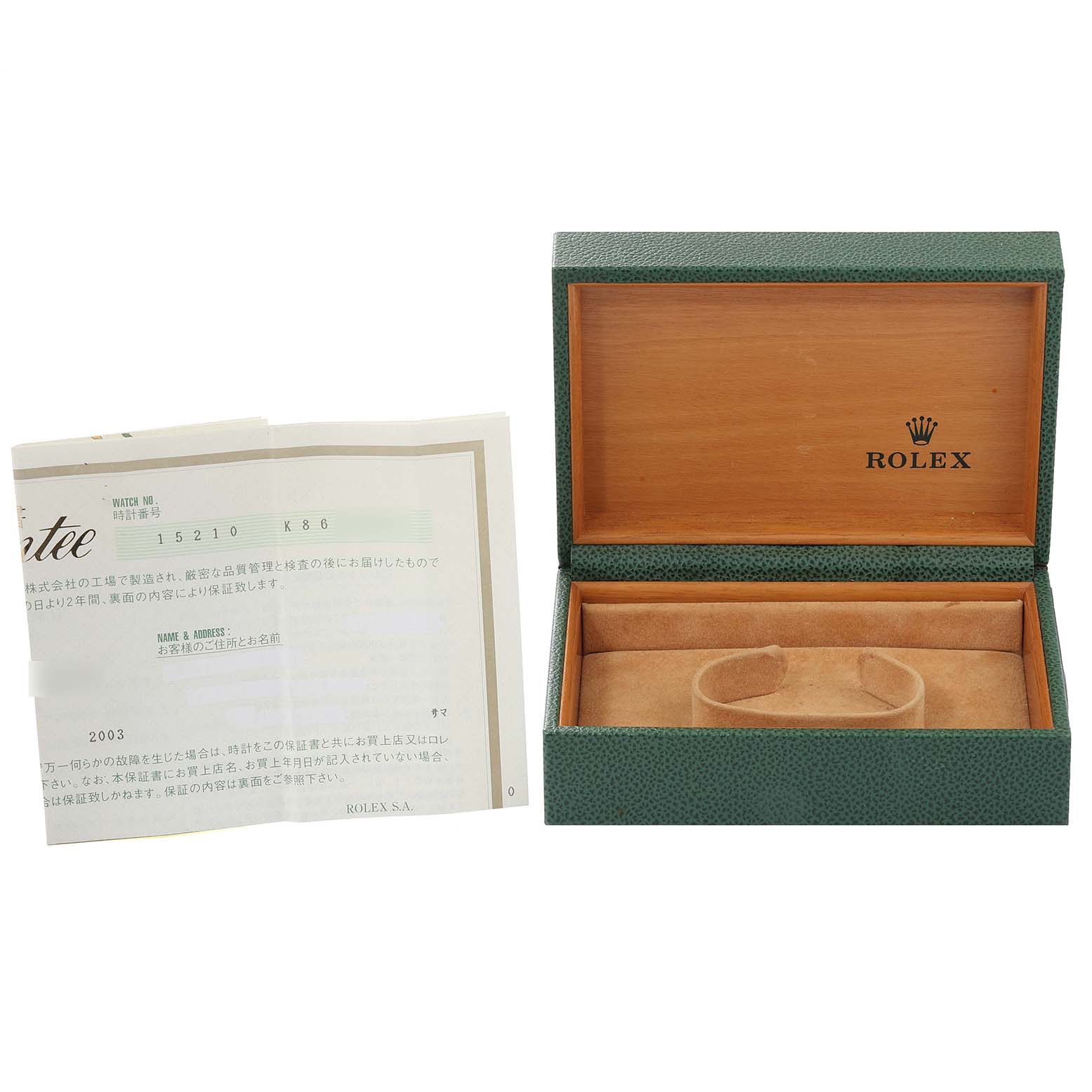 The image shows the open box and manual for a Rolex Date 15210 Men
s Stainless Steel Black Dial 15210 Men
s Stainless Steel Black Dial model watch.