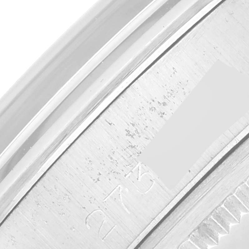 The image shows a close-up of the watch's case back rim, displaying part of the engraving on the Rolex Vintage Collection 1500 Men's Stainless Steel Silver Dial 1500 Men's Stainless Steel Silver Dial model.