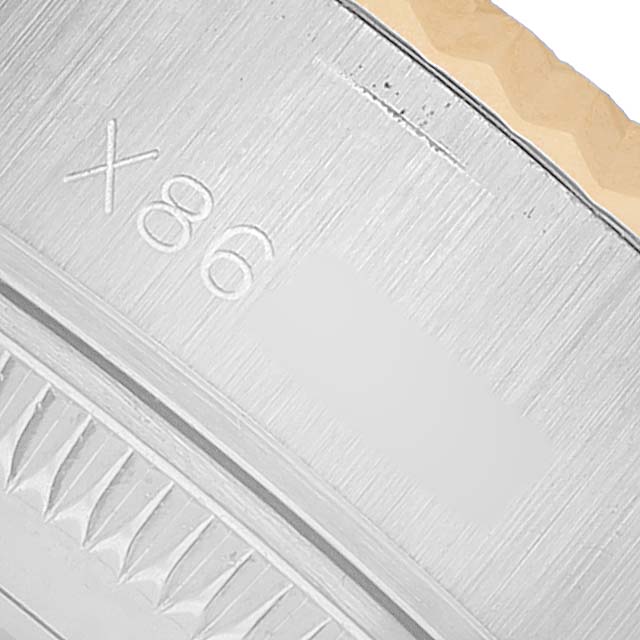 The image shows a close-up of the side and partially engraved parts of a Rolex Datejust 69173 Women's Stainless Steel Grey Dial watch case.