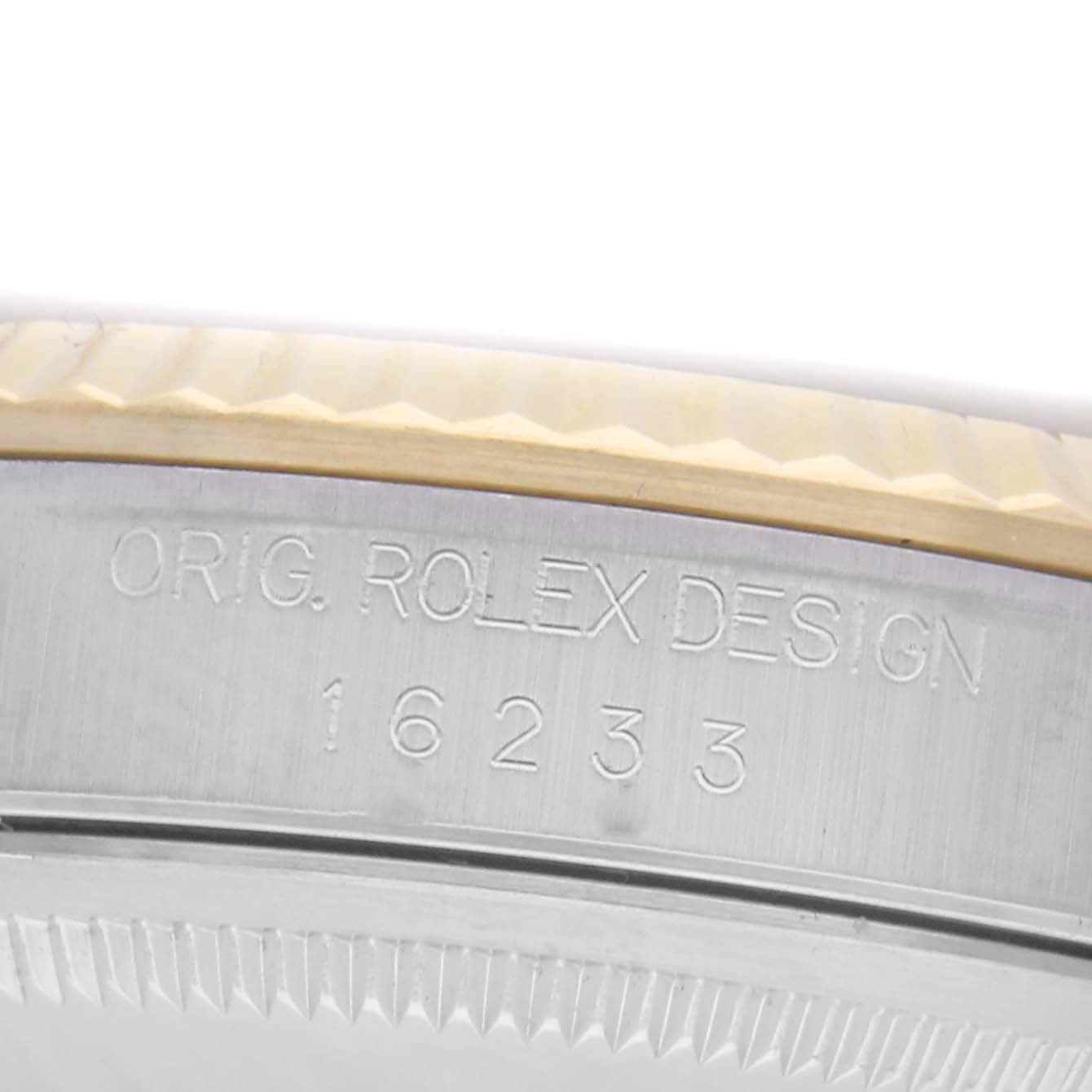 The image shows a close-up of the side of a Rolex Datejust 16233, highlighting the engraved model number and design details.