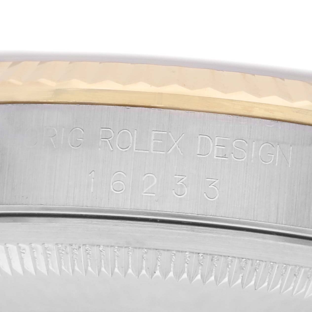 The image shows a close-up of the engraved side of the Rolex Datejust model 16233, focusing on the bezel and model number.