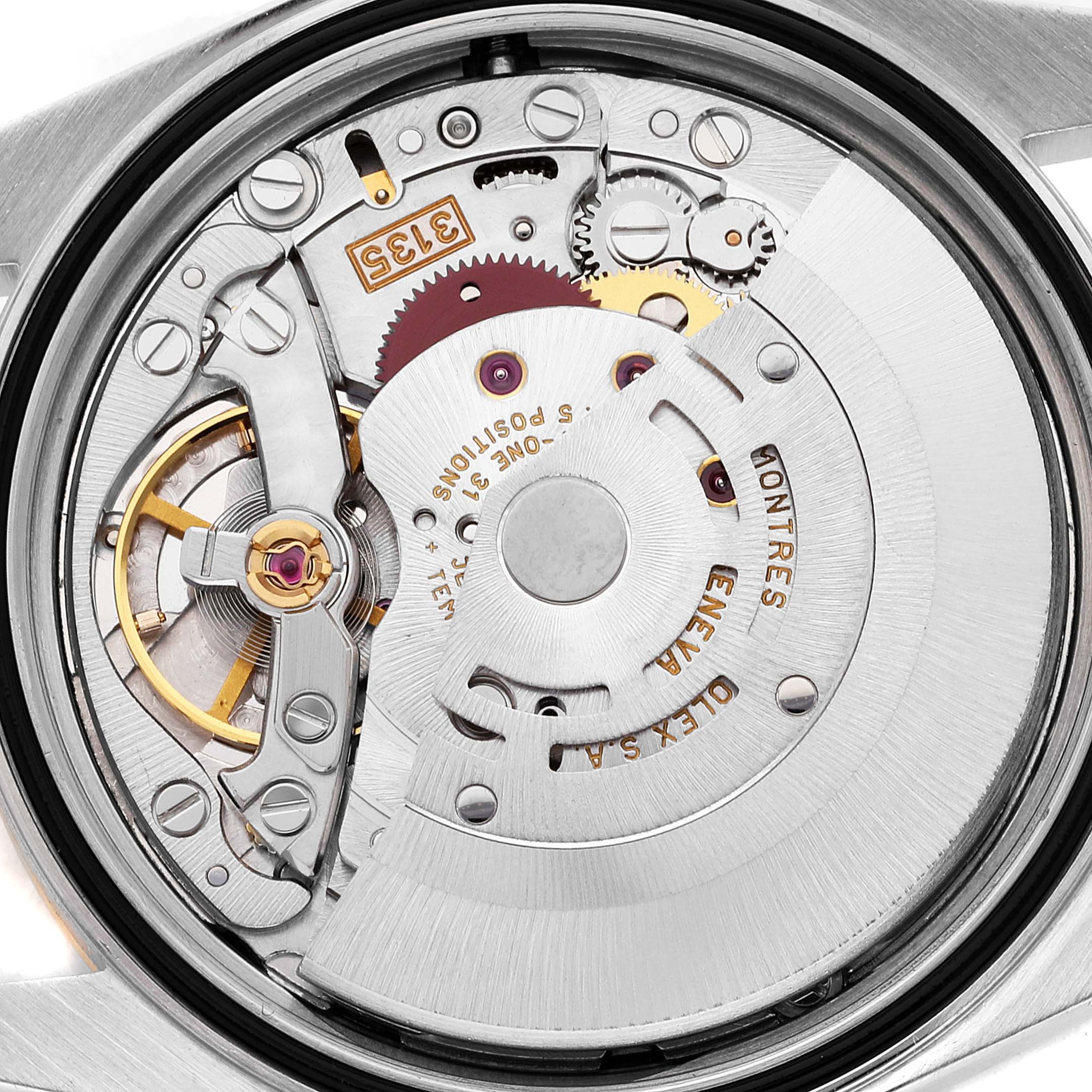 The image shows a close-up view of the movement mechanism inside a Rolex Datejust 16203 Men
s Steel and Gold (two tone) Grey Dial 16203 Men
s Steel and Gold (two tone) Grey Dial watch.