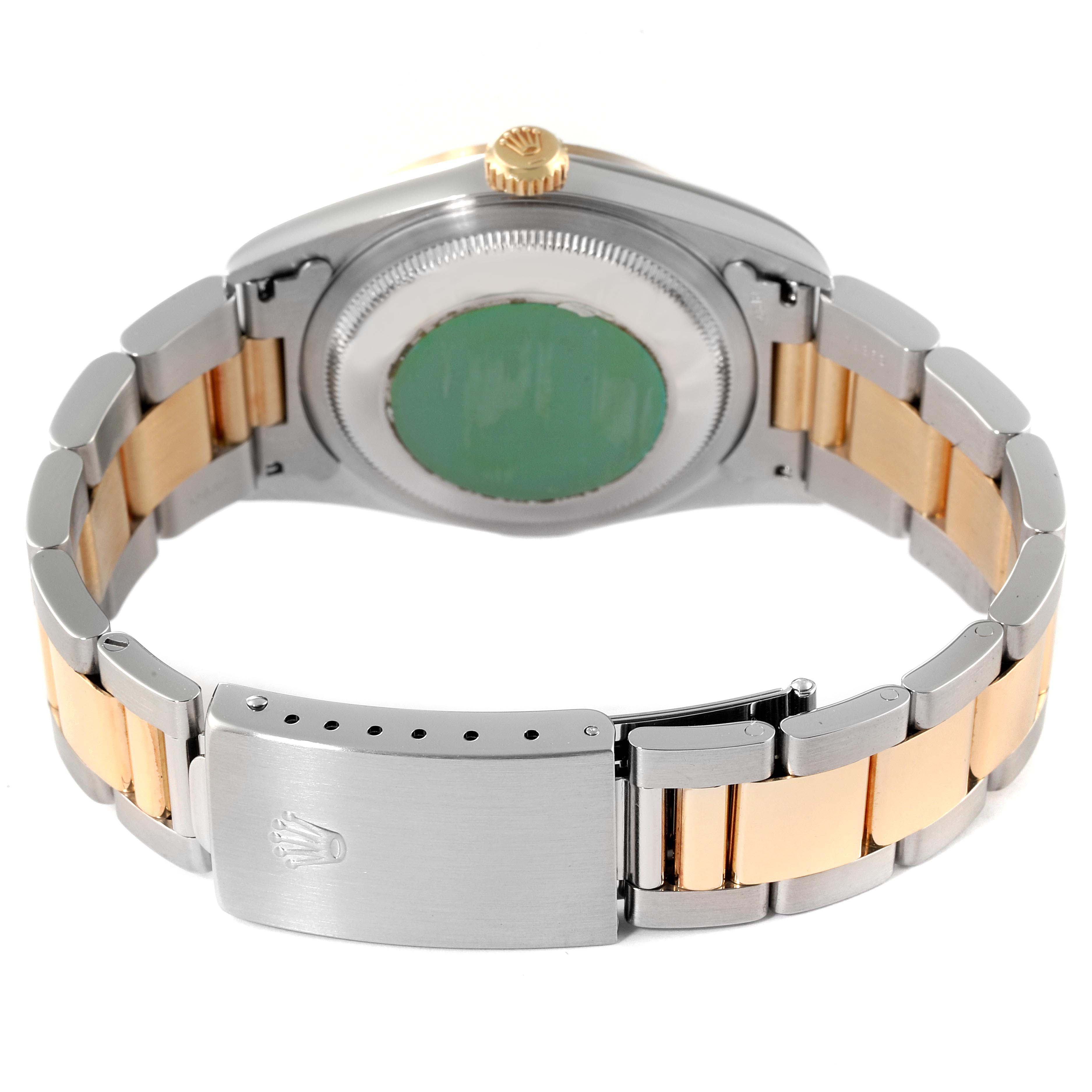 The image shows the back view of a Rolex Datejust 16203 Men
s Steel and Gold (two tone) Grey Dial 16203 Men
s Steel and Gold (two tone) Grey Dial watch, displaying its case back, bracelet, and clasp.