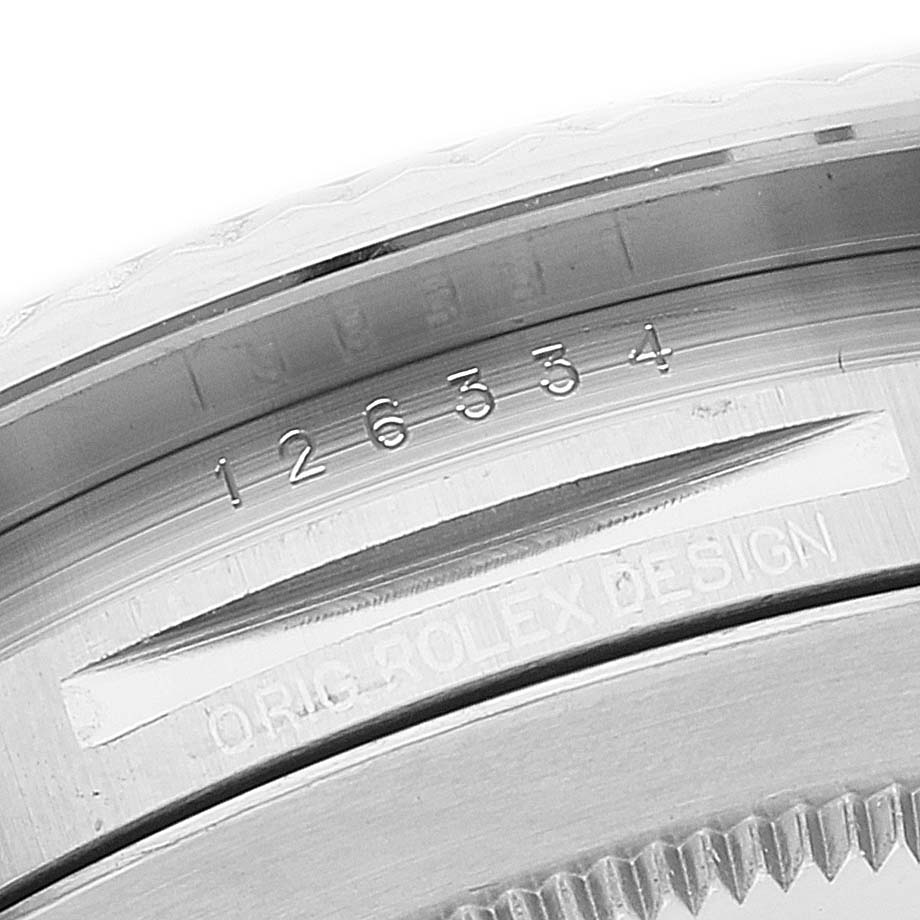 This close-up angle shows the engraved serial and model numbers on the case of a Rolex Datejust 41 126334 Men's Stainless Steel Blue Dial 126334 Men's Stainless Steel Blue Dial.