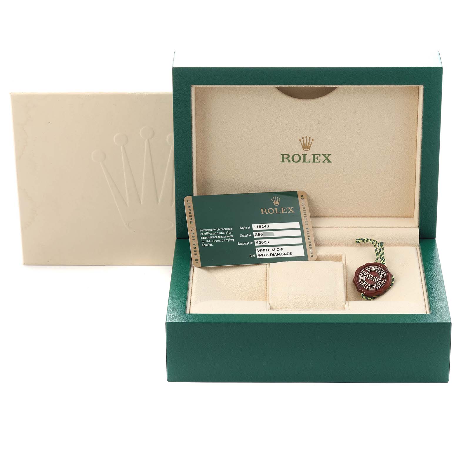 The image shows a Rolex Datejust model 116243 watch box and accessories, including the warranty card and a tag, viewed from the top.