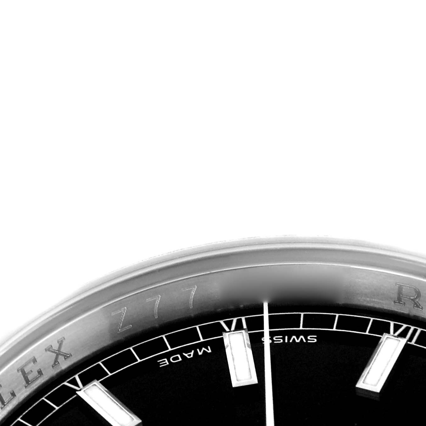 The image shows a close-up of the dial edge and bezel of a Rolex Datejust model 116234, highlighting the indices and part of the "Swiss Made" text.