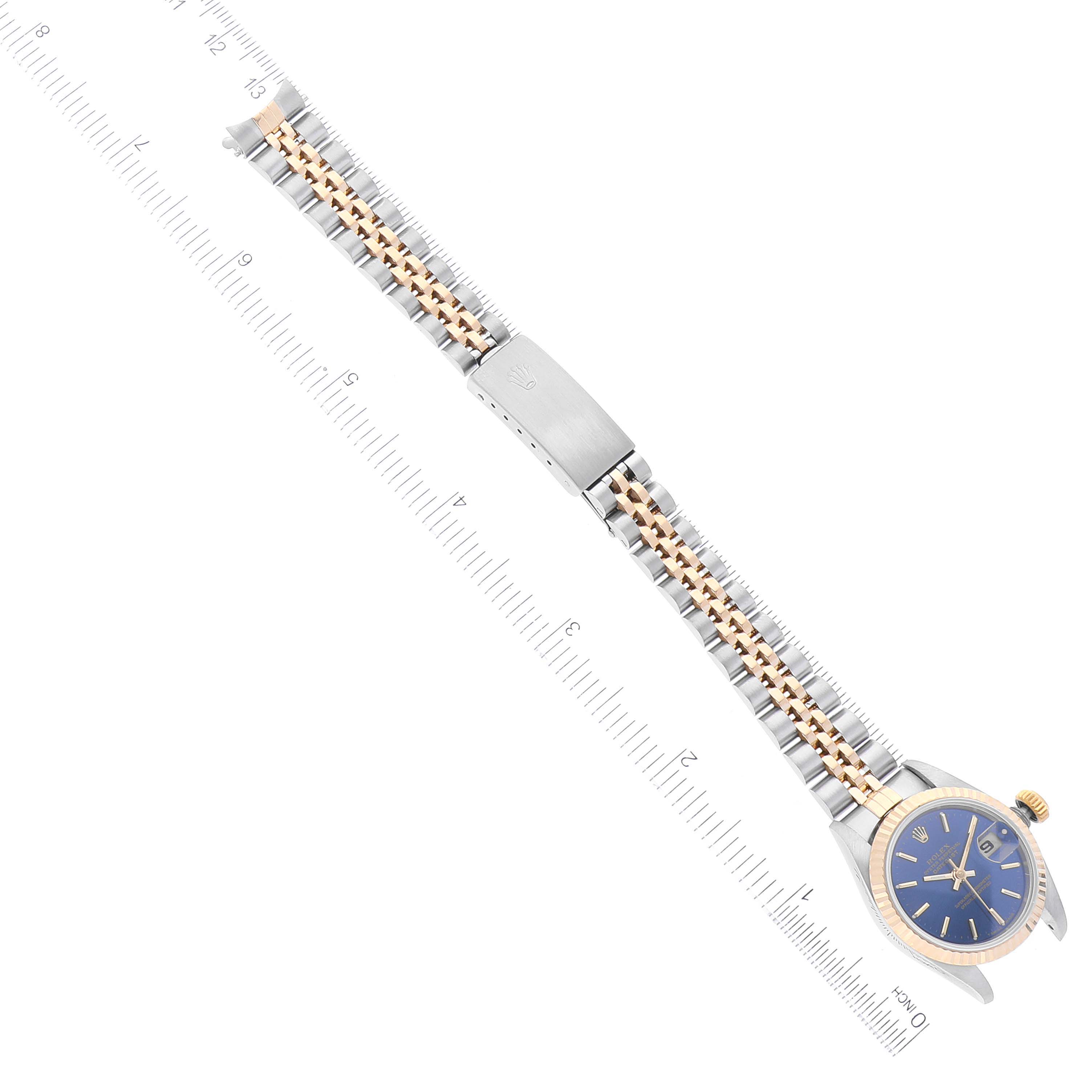 The image shows a Rolex Datejust 69173 Women's Steel and Gold (two tone) Blue Dial 69173 Women's Steel and Gold (two tone) Blue Dial watch laid flat, displaying the face, bracelet, and clasp next to a ruler for measurement.