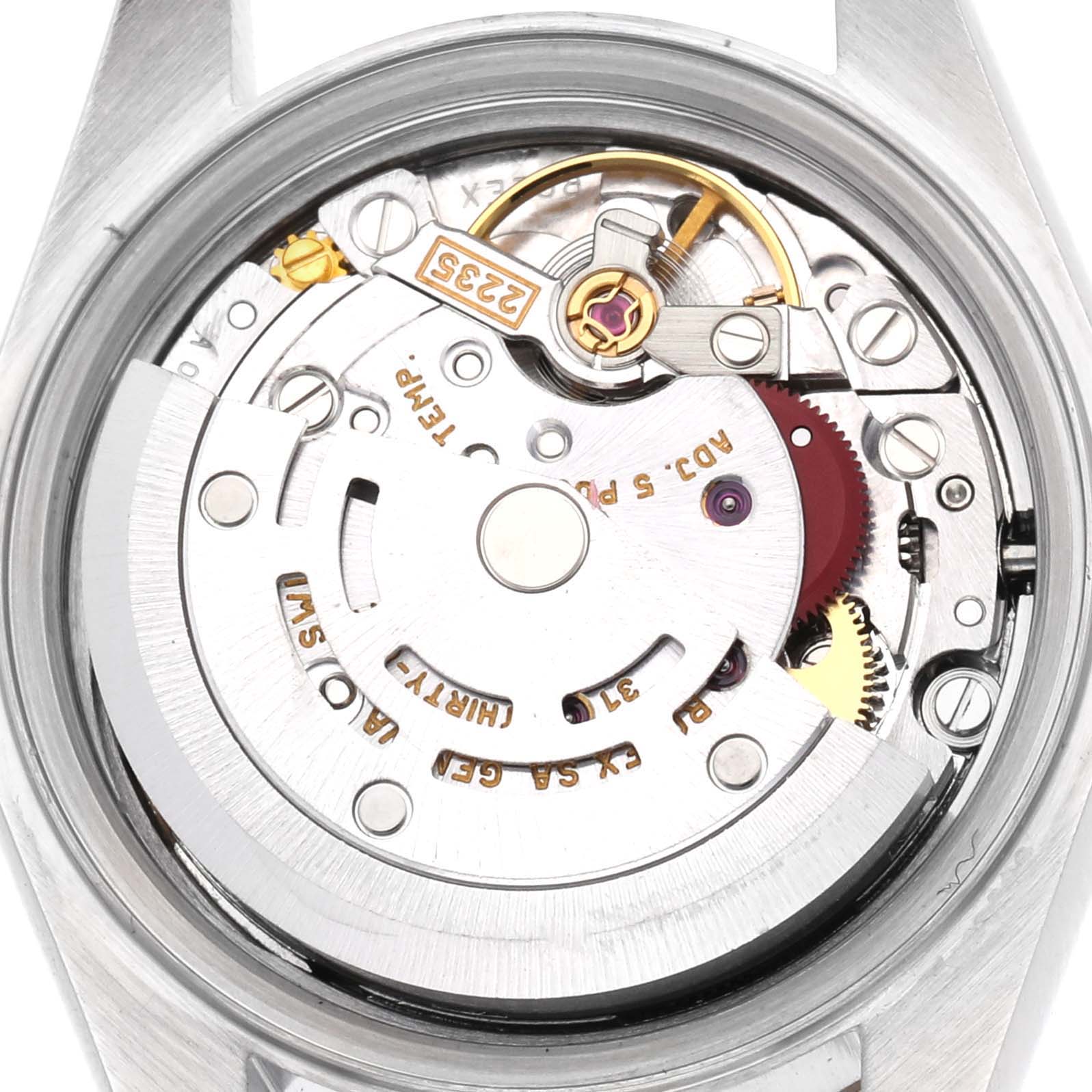 The image shows the back view of a Rolex Datejust model 79173, revealing the intricate movement and internal components of the watch.