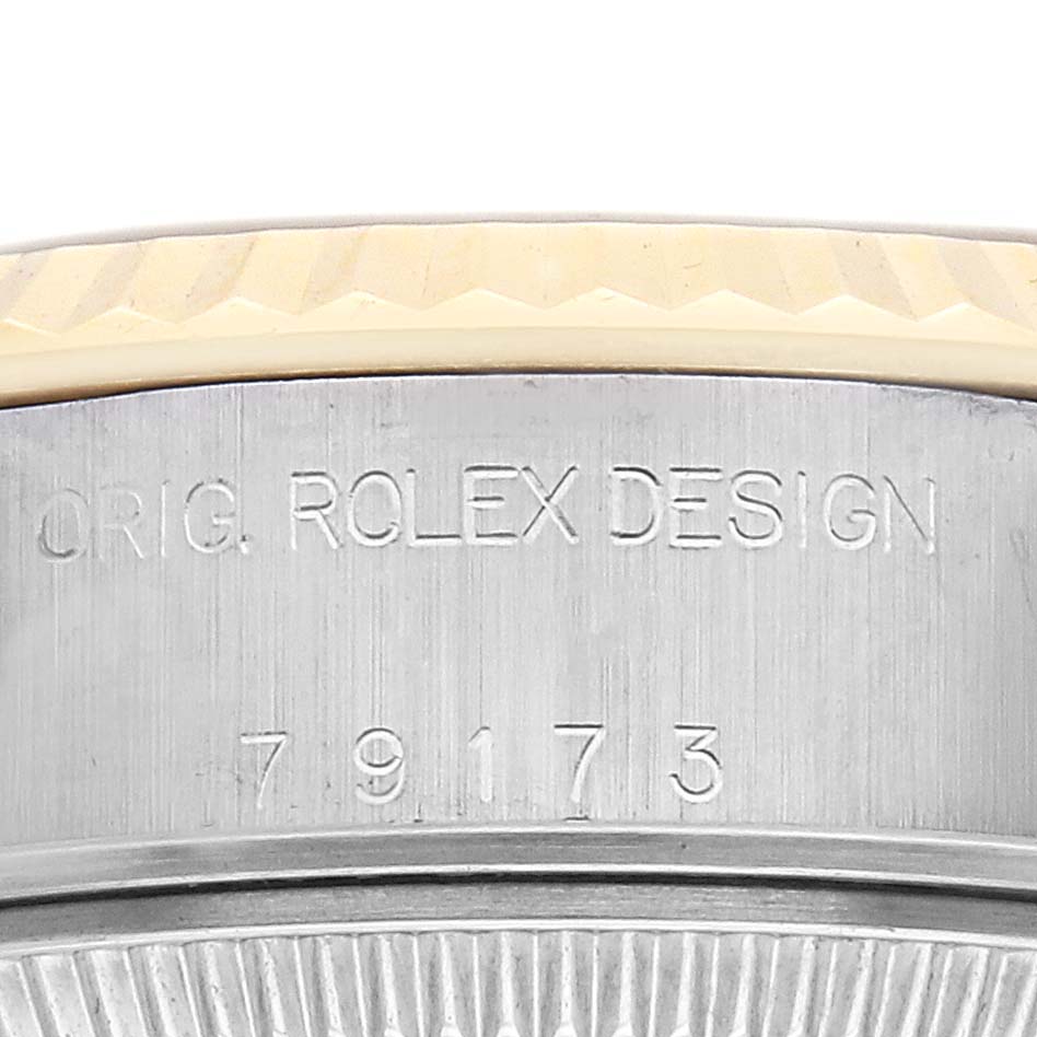 The image shows the side of a Rolex Datejust watch, model 79173, highlighting its engraved original design marking and model number.