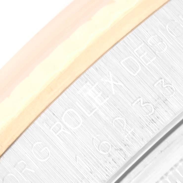 This close-up image shows the edge of the bezel and part of the case inscription of a Rolex Datejust 16233 Men's Steel and Gold (two tone) Champagne Dial 16233 Men's Steel and Gold (two tone) Champagne Dial watch.