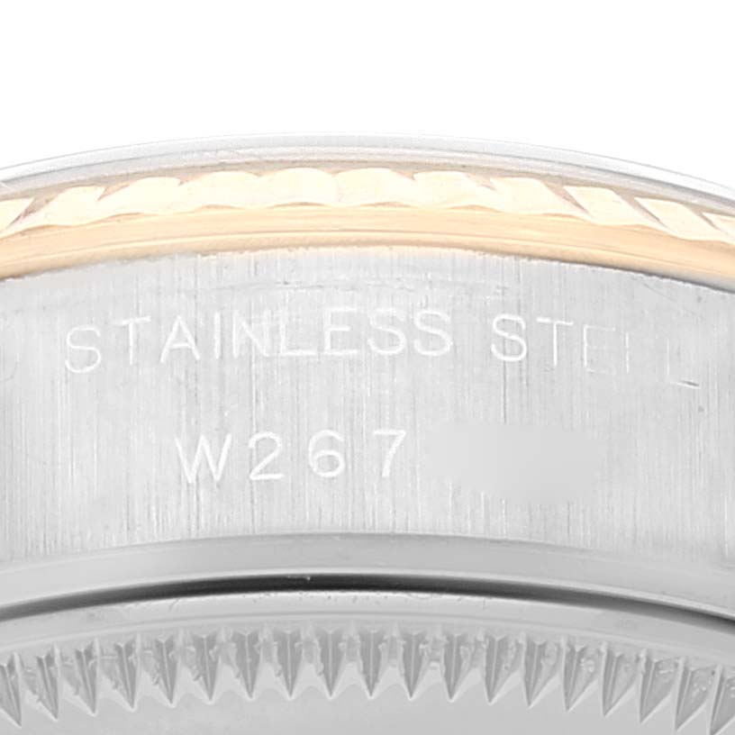 This image shows a close-up of the stainless steel case and serial number of a Rolex Datejust 69173 Women
s Steel and Gold (two tone) White Dial 69173 Women
s Steel and Gold (two tone) White Dial watch.
