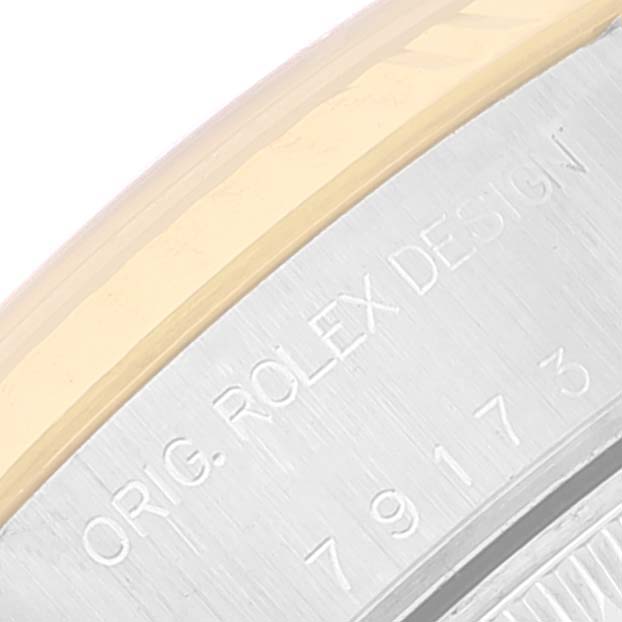 The image shows a close-up view of the case back engraving of a Rolex Datejust 79173 Women
s Steel and Gold (two tone) Silver Dial 79173 Women
s Steel and Gold (two tone) Silver Dial watch, displaying the model number and brand inscription.