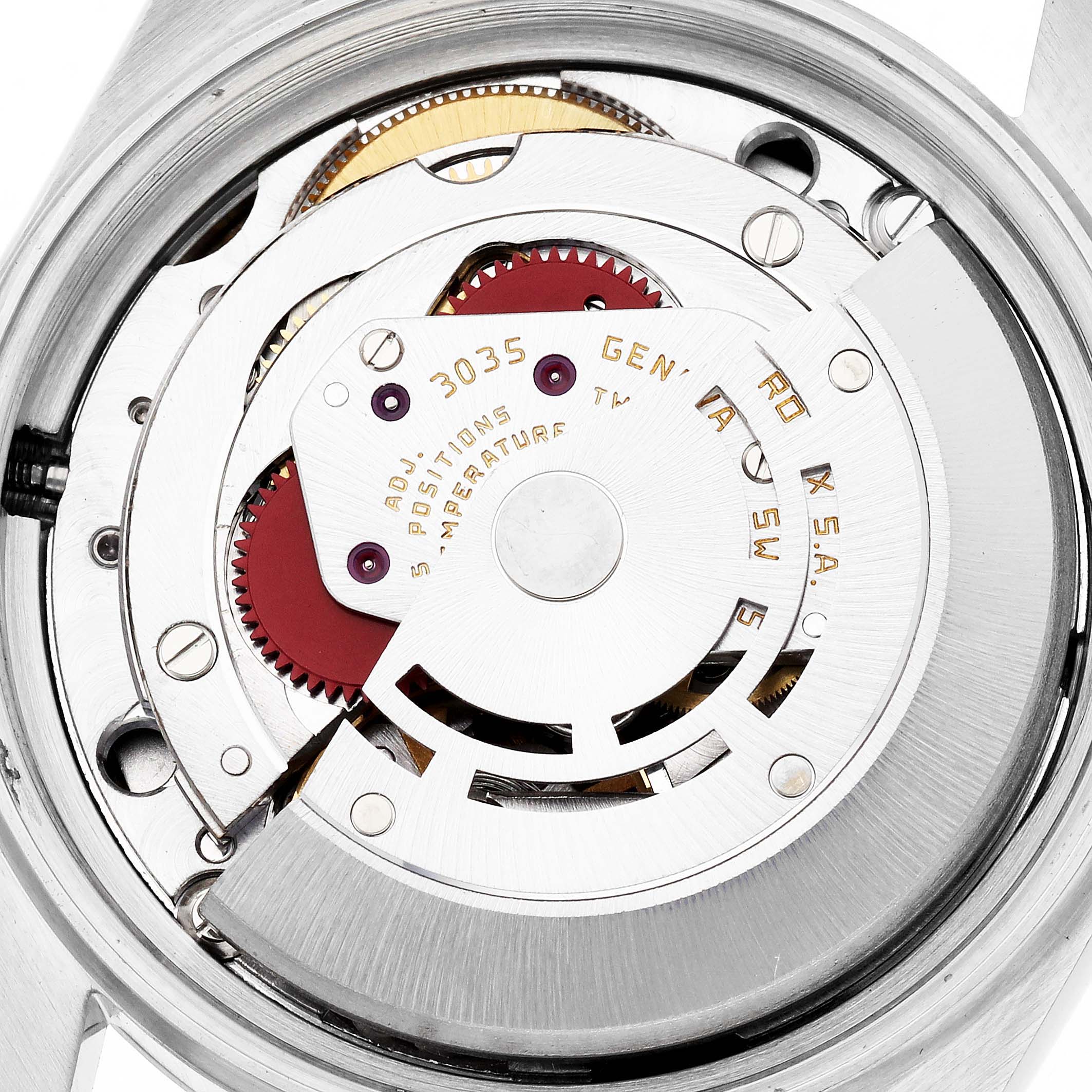 The image shows the movement of a Rolex Datejust model 16013 men's watch, focusing on the intricate gears and mechanical components from a top view.