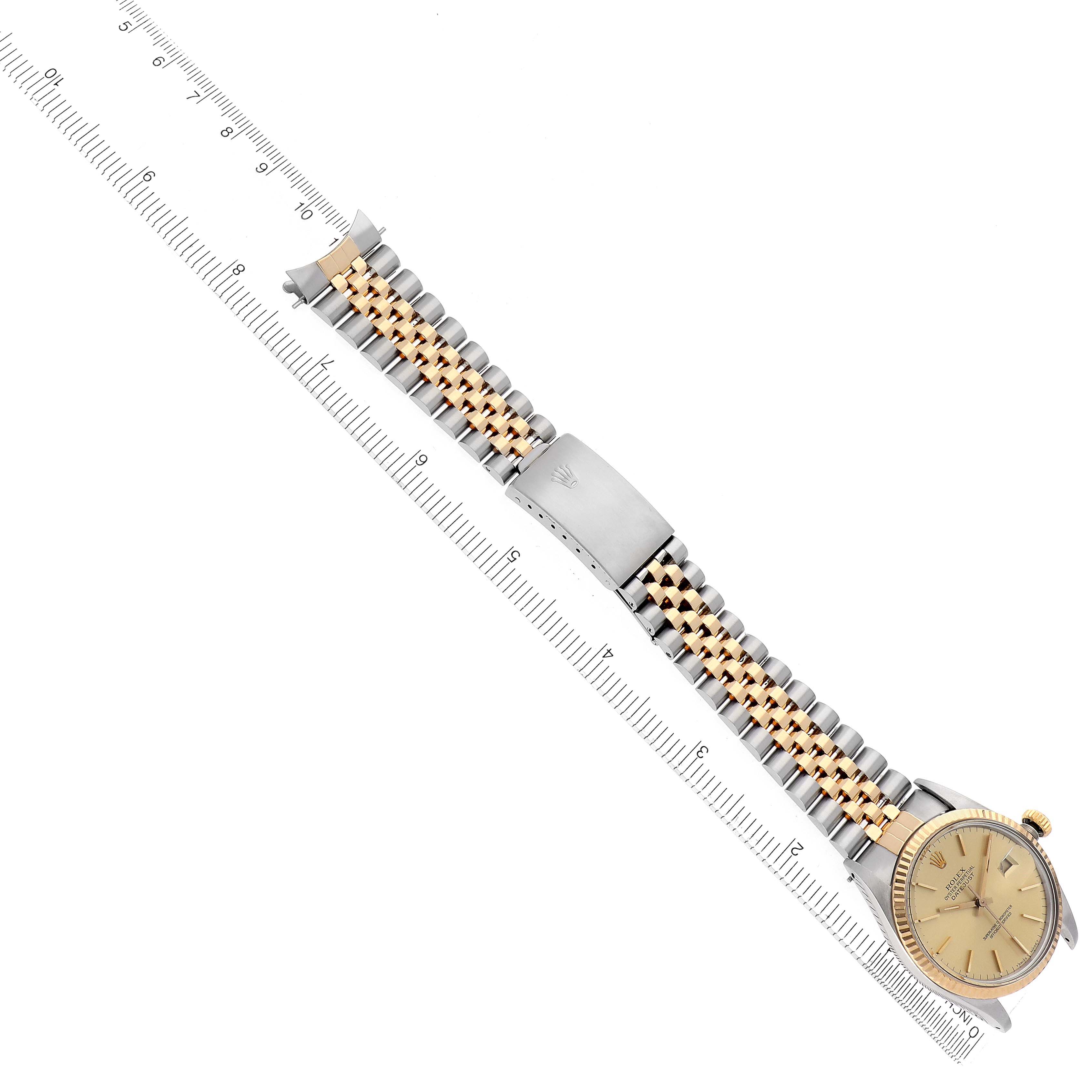 The image shows a Rolex Datejust model 16013 men's watch at an angled view, displaying the face, Jubilee bracelet, and clasp alongside a ruler for scale.