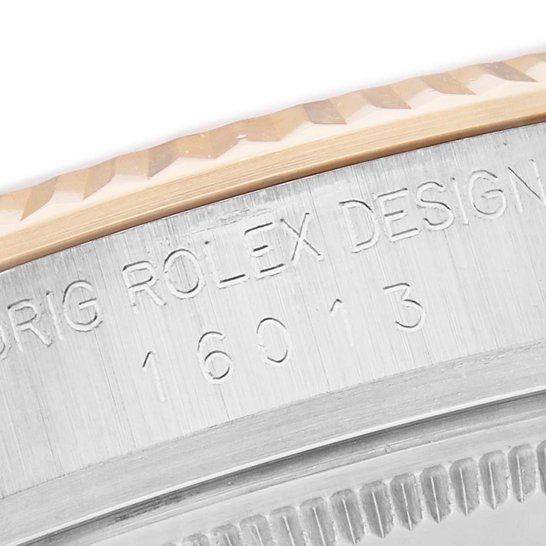 The image shows a close-up of the side of a Rolex Datejust model 16013, highlighting the engraved model number and part of the fluted bezel.