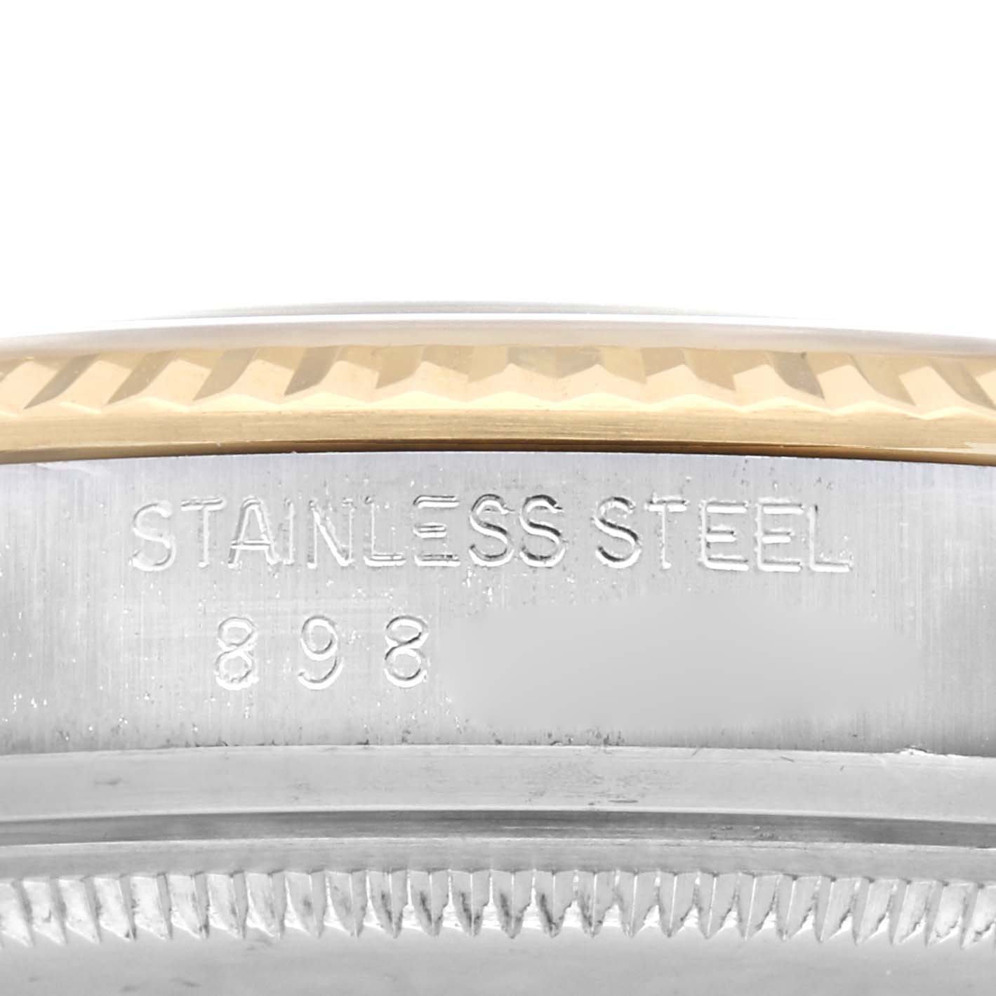 The image shows a side view of the Rolex Vintage Collection model number 16013 case, highlighting the stainless steel engraving.