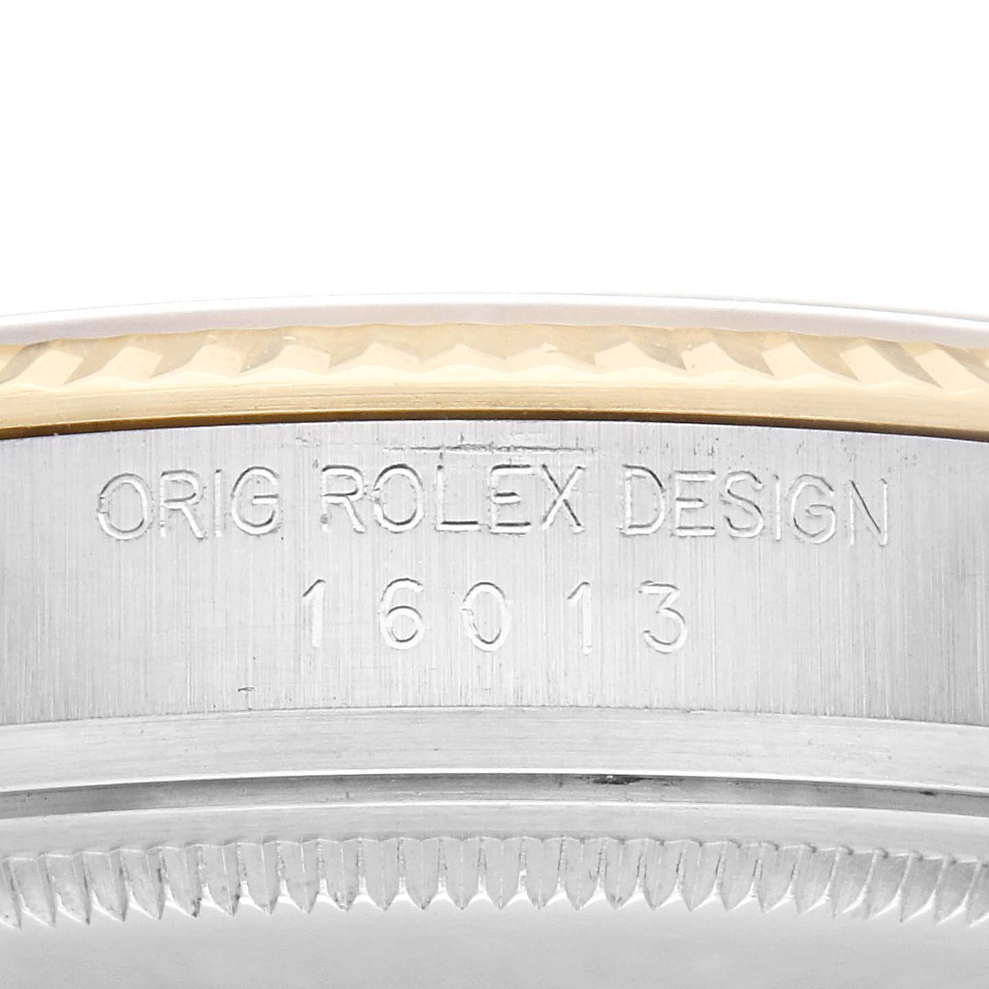The image shows a close-up of the engraved side bezel of a Rolex Vintage Collection model, model number 16013, highlighting the "ORIG ROLEX DESIGN" inscription.