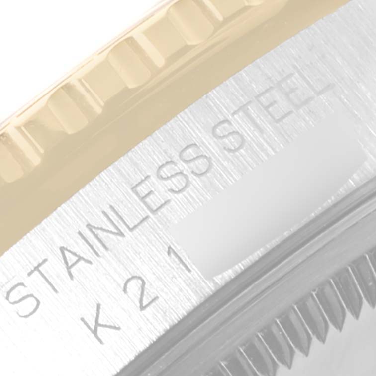 This close-up image shows the engraved stainless steel casing of a Rolex Turn-o-Graph 16263 Men
s Steel and Gold (two tone) Champagne Dial 16263 Men
s Steel and Gold (two tone) Champagne Dial watch.