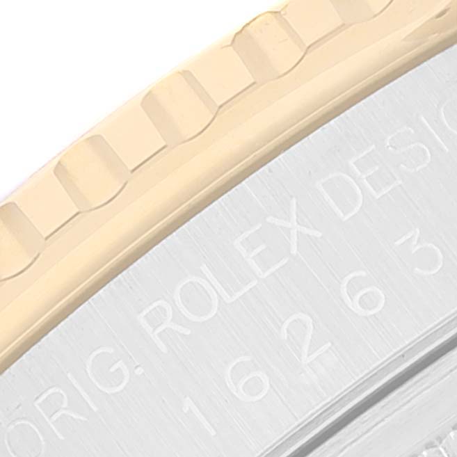 This close-up image shows part of the bezel and engraved text on the case of a Rolex Turn-o-Graph 16263 Men
s Steel and Gold (two tone) Champagne Dial 16263 Men
s Steel and Gold (two tone) Champagne Dial watch.