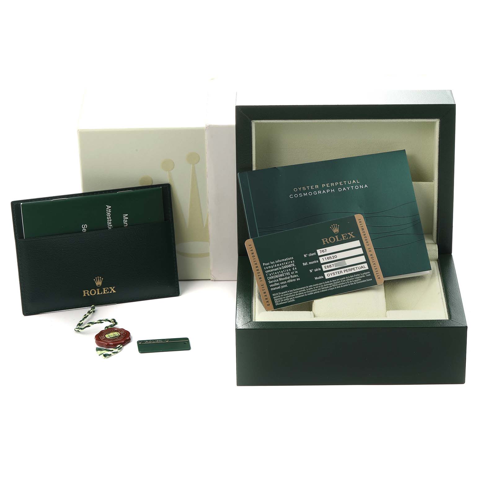 The image shows accessories for the Rolex Daytona 116520, including the watch box, warranty card, booklet, and cardholder.