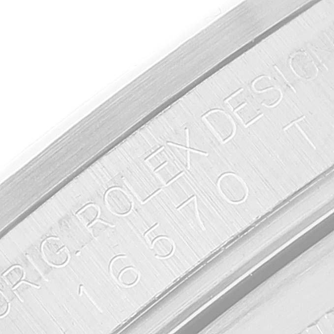 The image shows a close-up of the serial number and "Rolex Design" engraving on the case of a Rolex Explorer 16570 Men's Stainless Steel White Dial 16570 Men's Stainless Steel White Dial watch.
