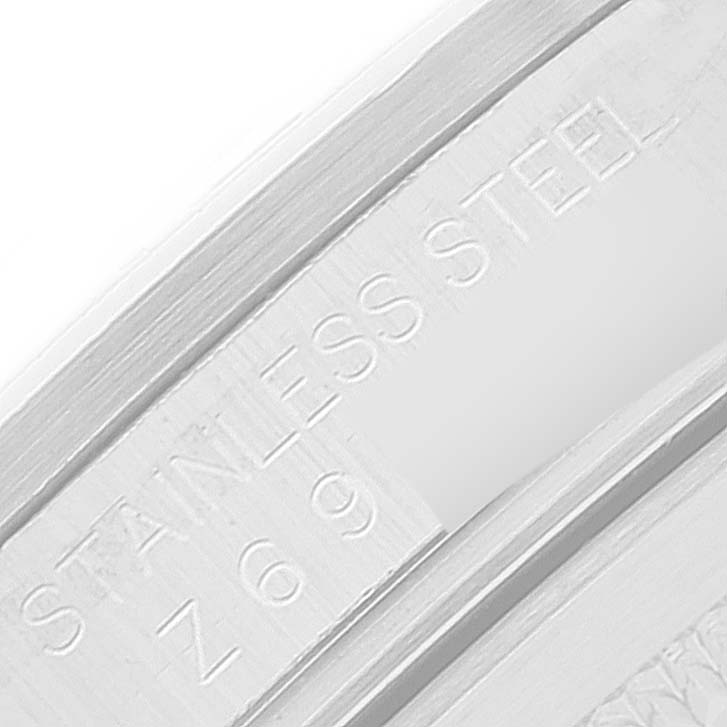 The image shows a close-up of the stainless steel part engraved with "STAINLESS STEEL" on a Rolex Explorer 16570 Men's Stainless Steel White Dial 16570 Men's Stainless Steel White Dial.