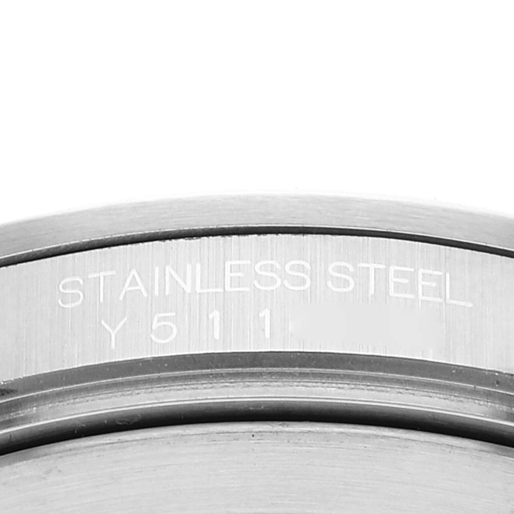 The image shows a close-up of the case back of a Rolex Explorer 16570 Men's Stainless Steel Black Dial 16570 Men's Stainless Steel Black Dial model, highlighting the stainless steel material and reference number.