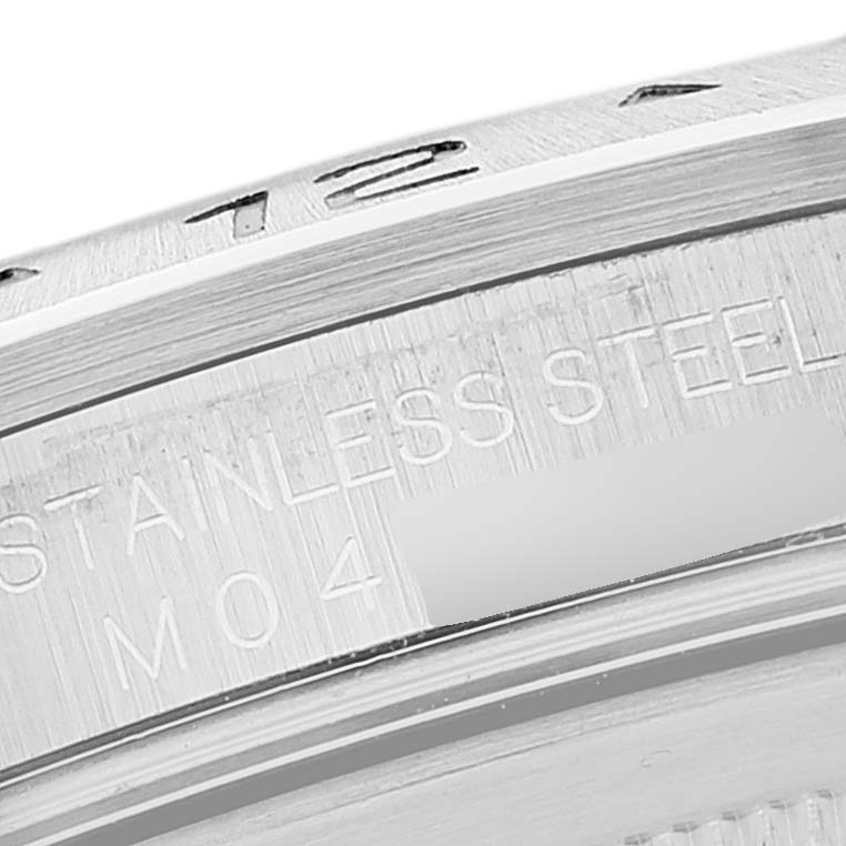 This image shows a close-up of the bezel and part of the stainless steel casing of a Rolex Explorer 16570 Men's Stainless Steel Black Dial 16570 Men's Stainless Steel Black Dial watch.
