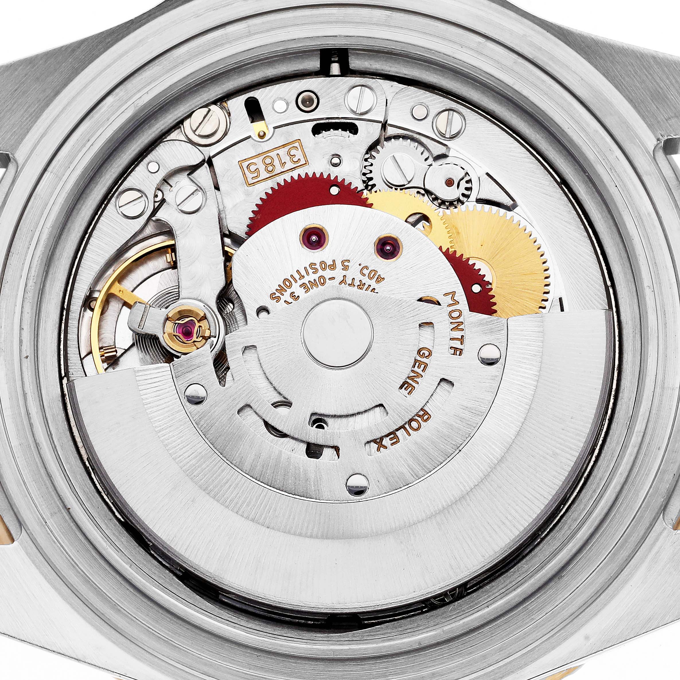 The image shows the movement of a Rolex GMT-Master model 16713 from a top-down angle, revealing the intricate gears and components of the watch's mechanism.