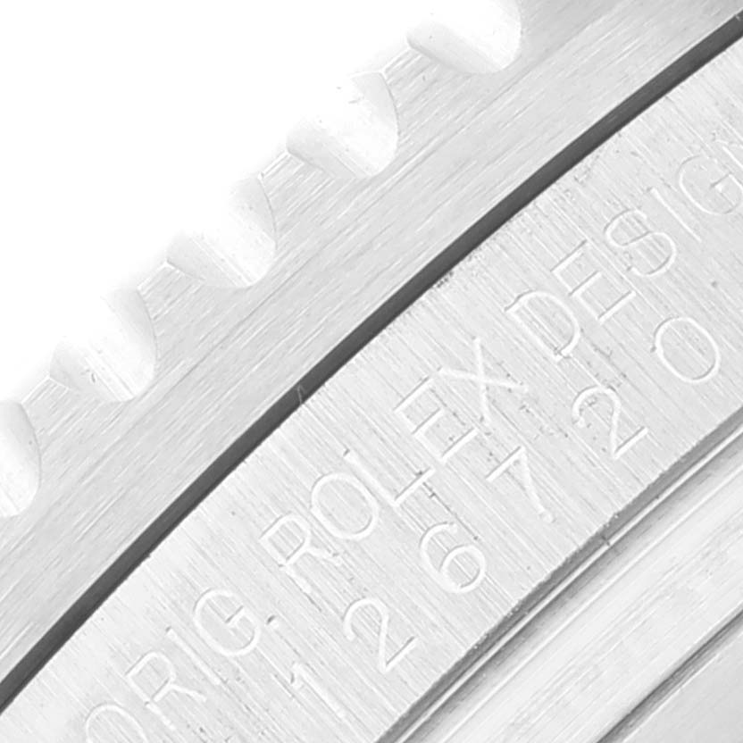 The image shows a close-up of the engraved side of the bezel on a Rolex GMT-Master 126720 Men's Stainless Steel Black Dial 126720 Men's Stainless Steel Black Dial watch.