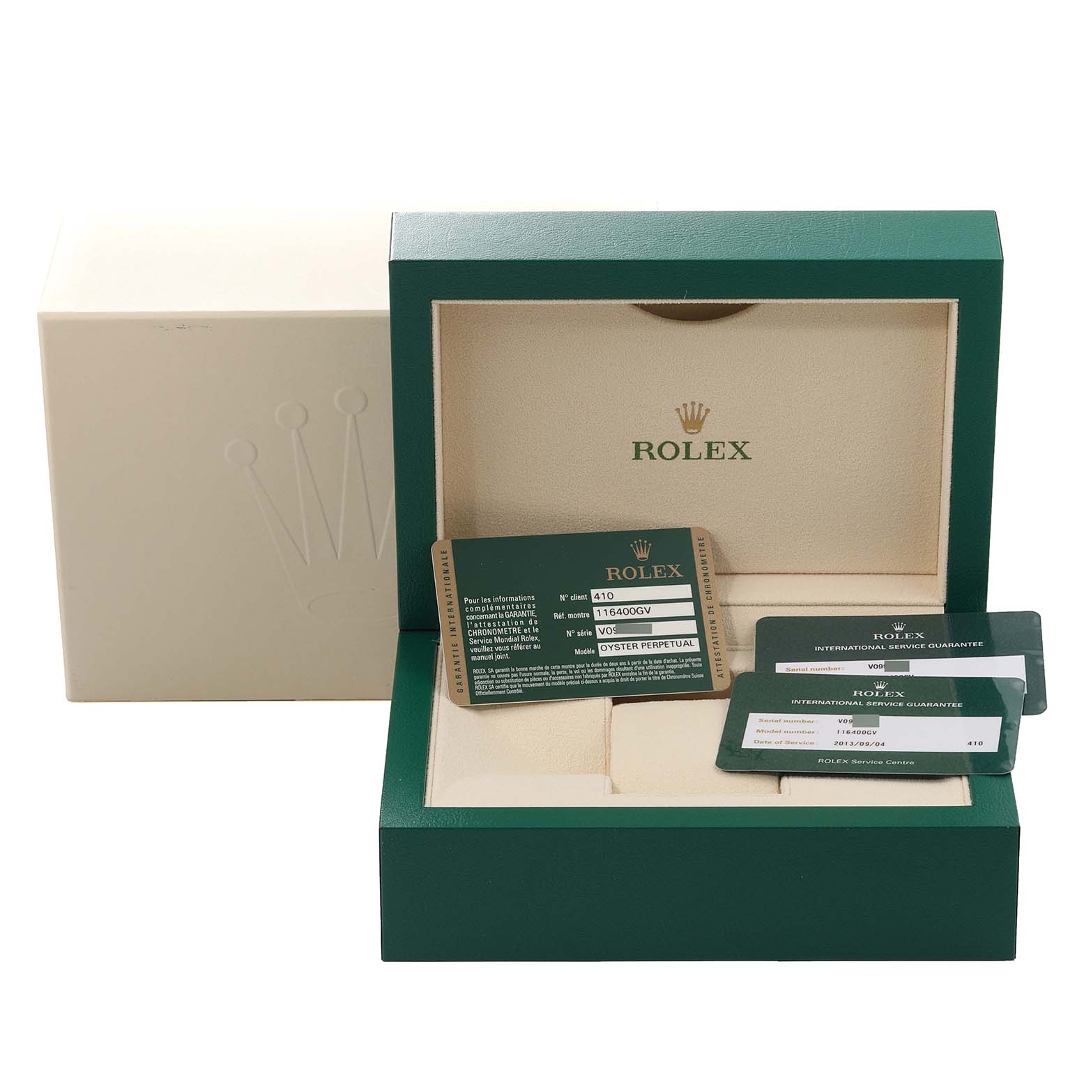 The image shows the packaging and authenticity cards for a Rolex Milgauss 116400 Men's Stainless Steel Black Dial 116400 Men's Stainless Steel Black Dial watch, including its green box and warranty cards.