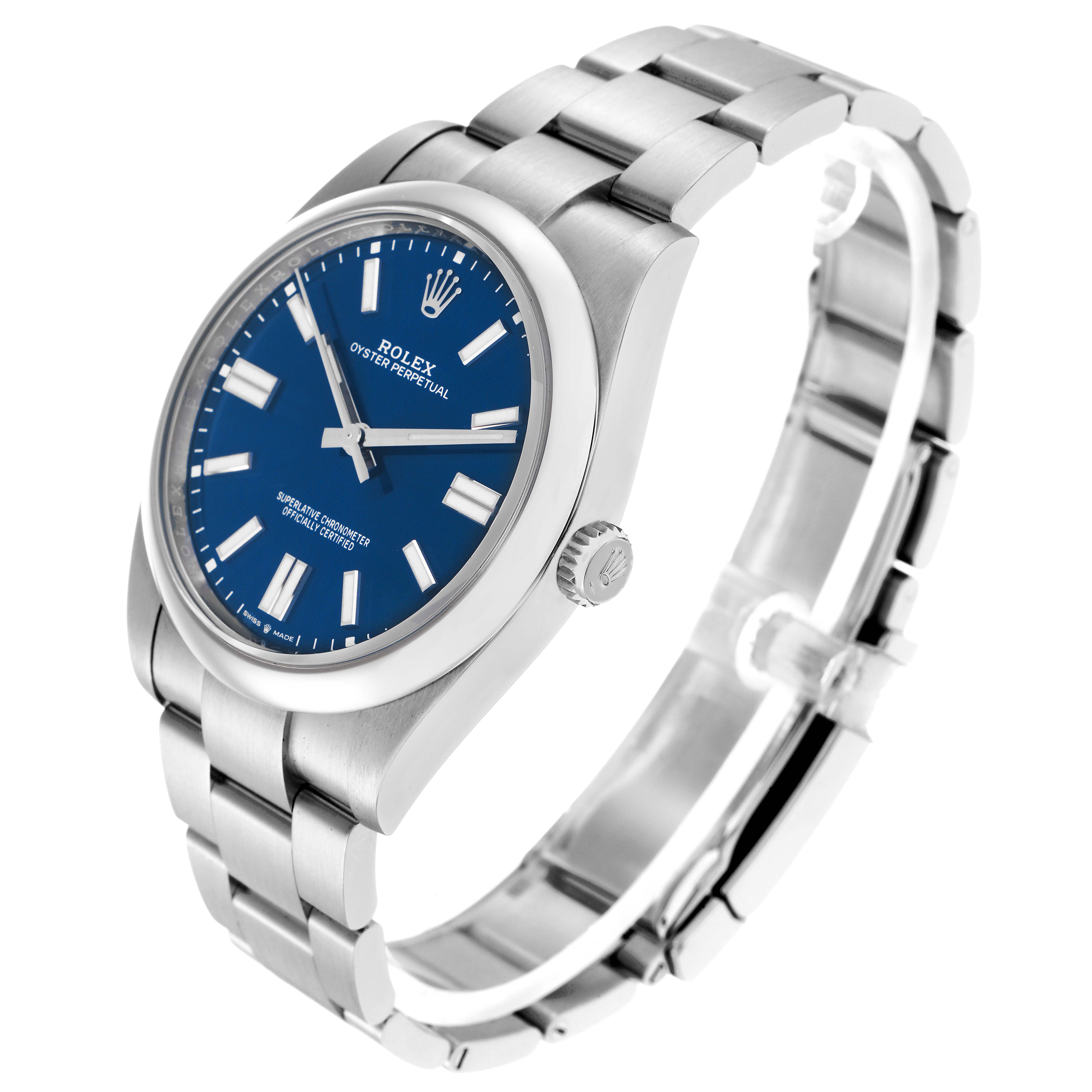 The Rolex Oyster Perpetual model 124300 is shown at an angled side view, highlighting the blue dial, bracelet, and crown of the men's watch.