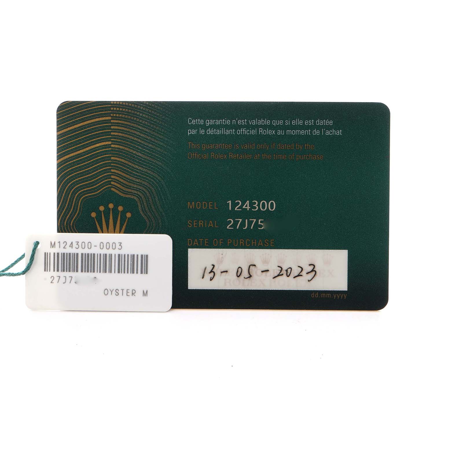 The image shows the guarantee card for a Rolex Oyster Perpetual, model number 124300, along with a tag displaying the same model and serial number.