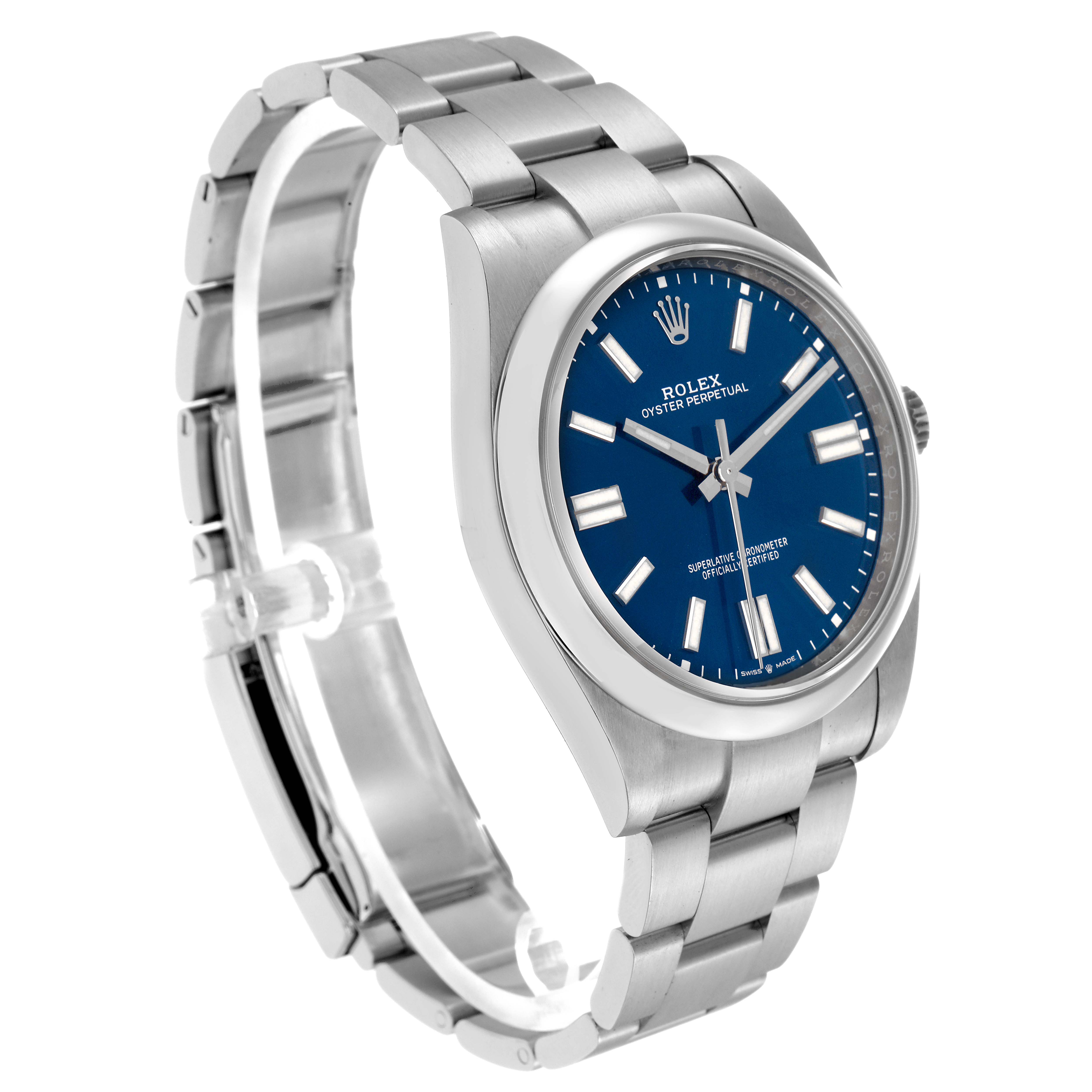 The image shows a Rolex Oyster Perpetual 124300 men's watch at a three-quarter angle, highlighting its blue dial, stainless steel case, and bracelet.