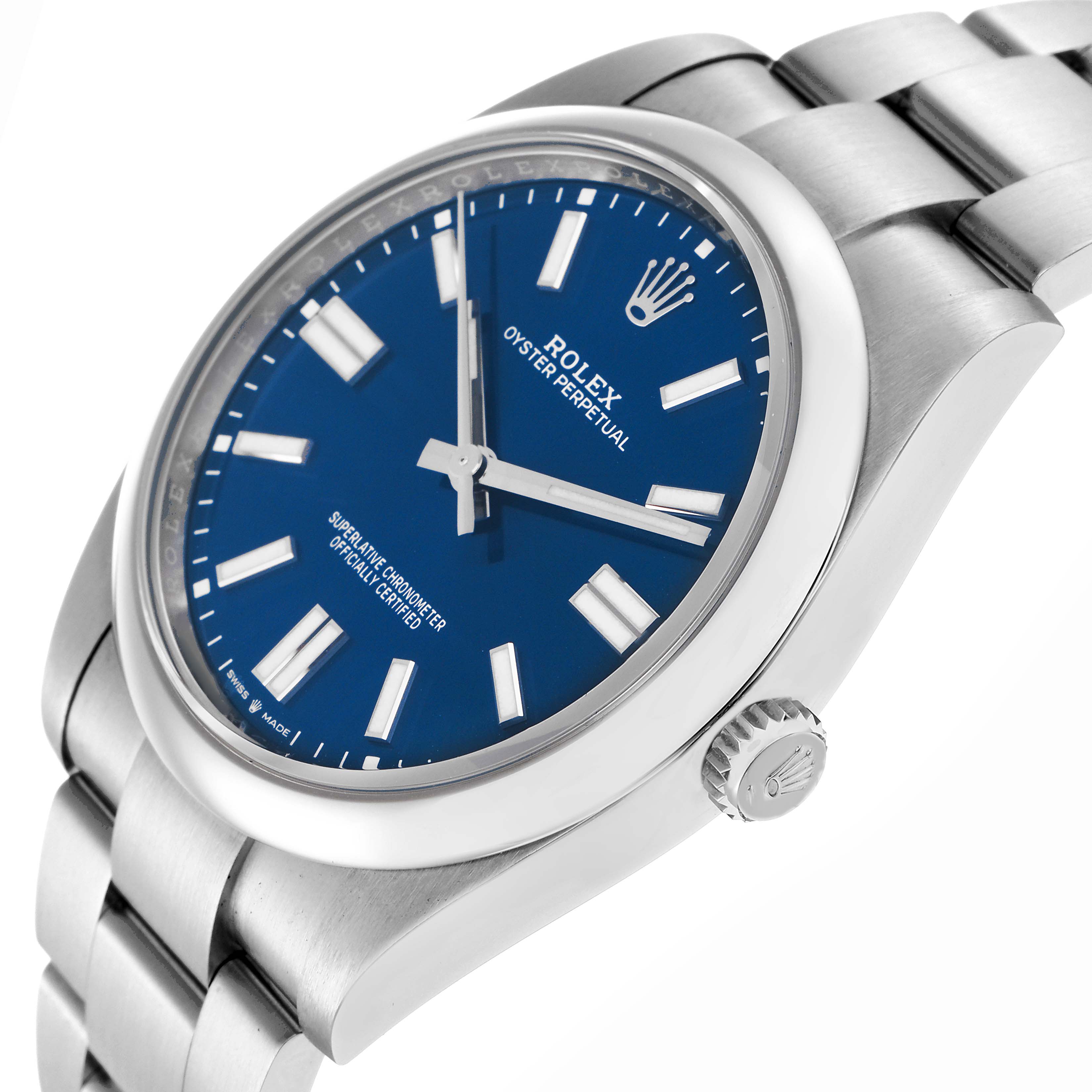 The Rolex Oyster Perpetual model 124300 watch is shown at an angle displaying the blue dial, hands, index markers, crown, and part of the bracelet.