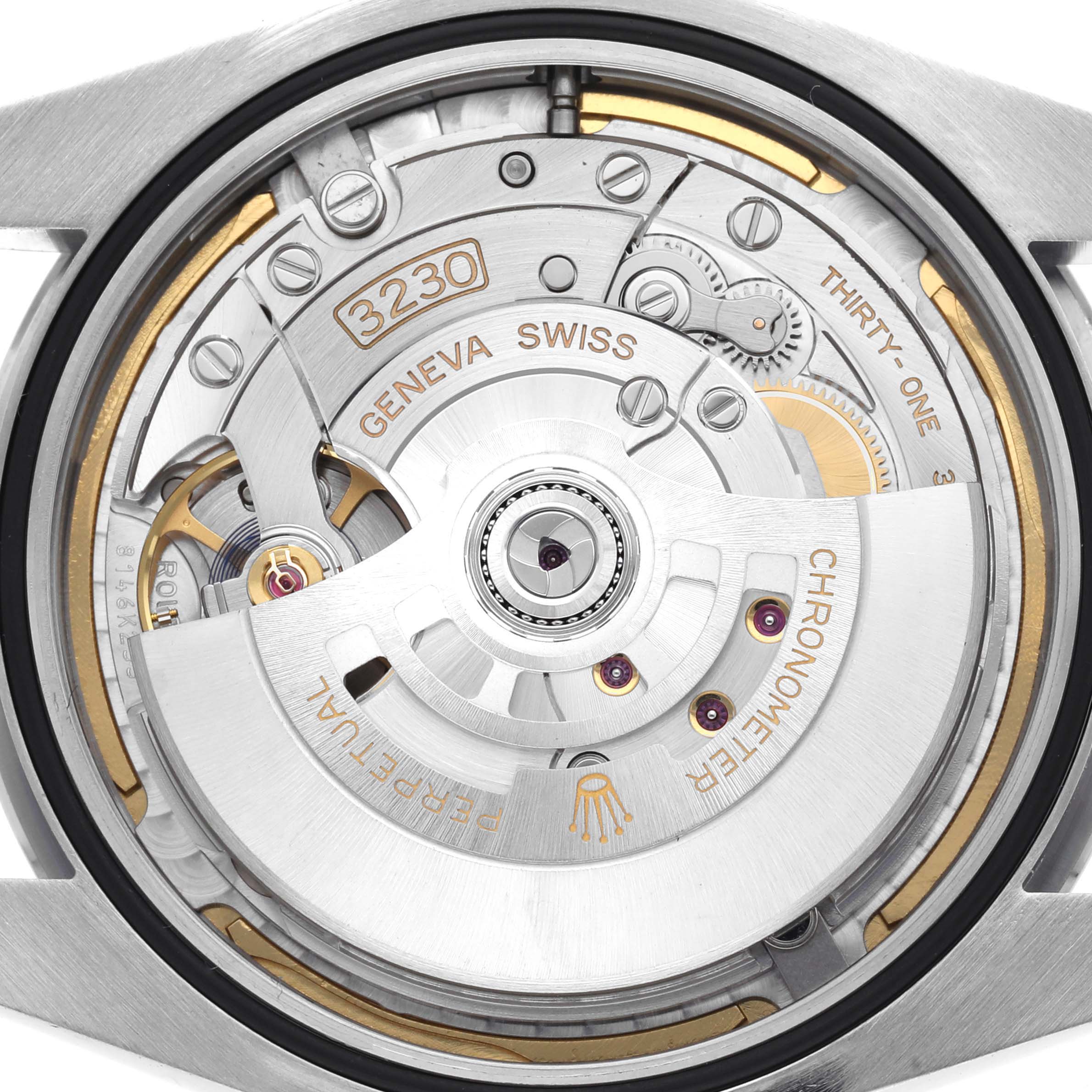 The image shows a close-up of the Rolex Oyster Perpetual 124300 movement, highlighting its intricate mechanics from the back view.