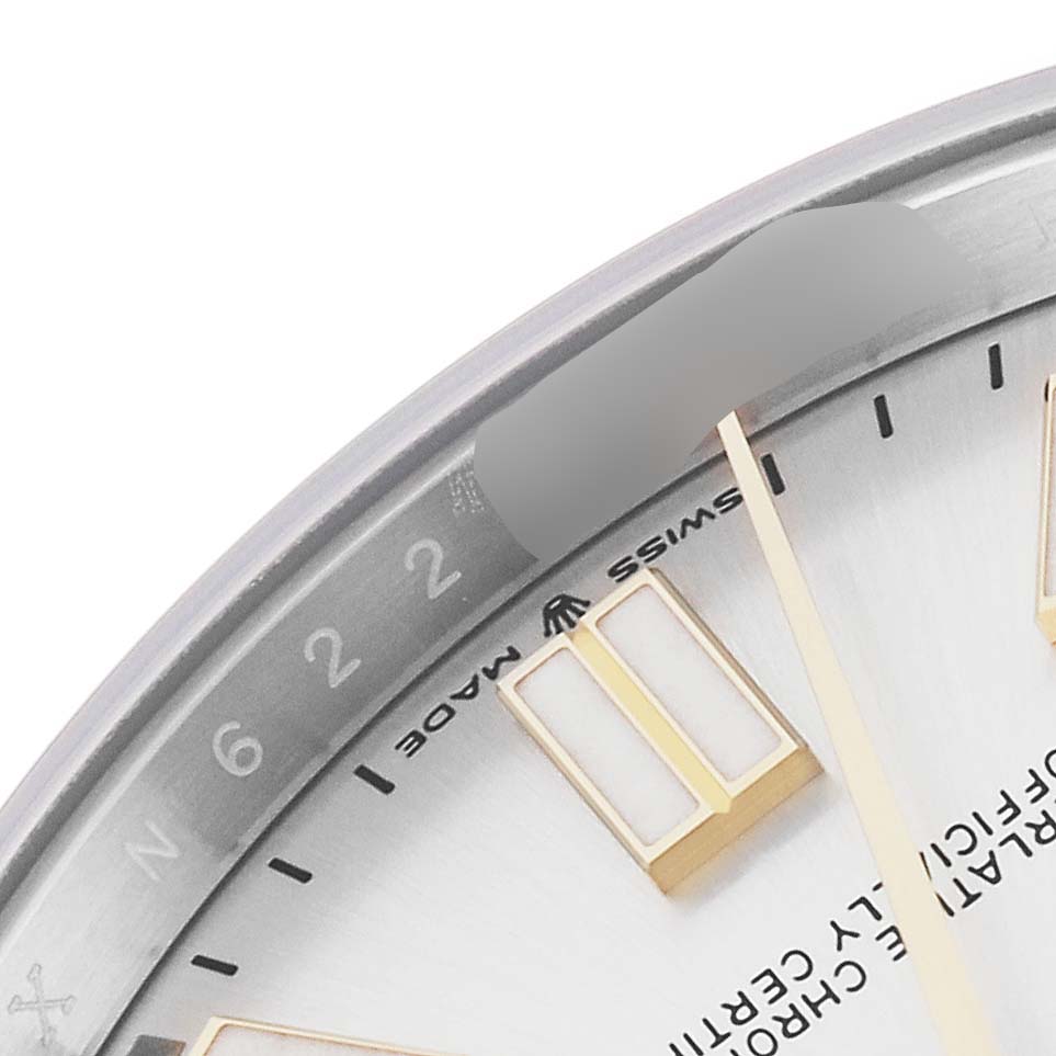 This image shows a close-up of the Rolex Oyster Perpetual 124300 Men's Stainless Steel Silver Dial 124300 Men's Stainless Steel Silver Dial watch dial, focusing on the markers and part of the inner bezel.