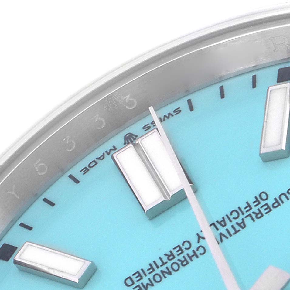 This image shows a close-up of the dial on the Rolex Oyster Perpetual model 124300, highlighting the hour markers and part of the "Swiss Made" text.