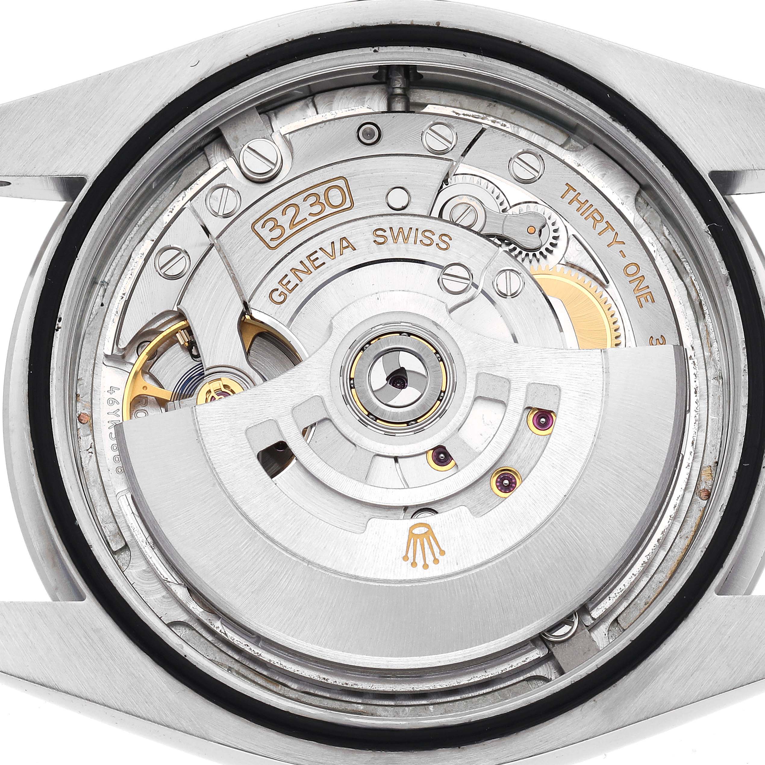 The image shows the movement of a Rolex Oyster Perpetual model number 124300, highlighting the intricate inner mechanisms.